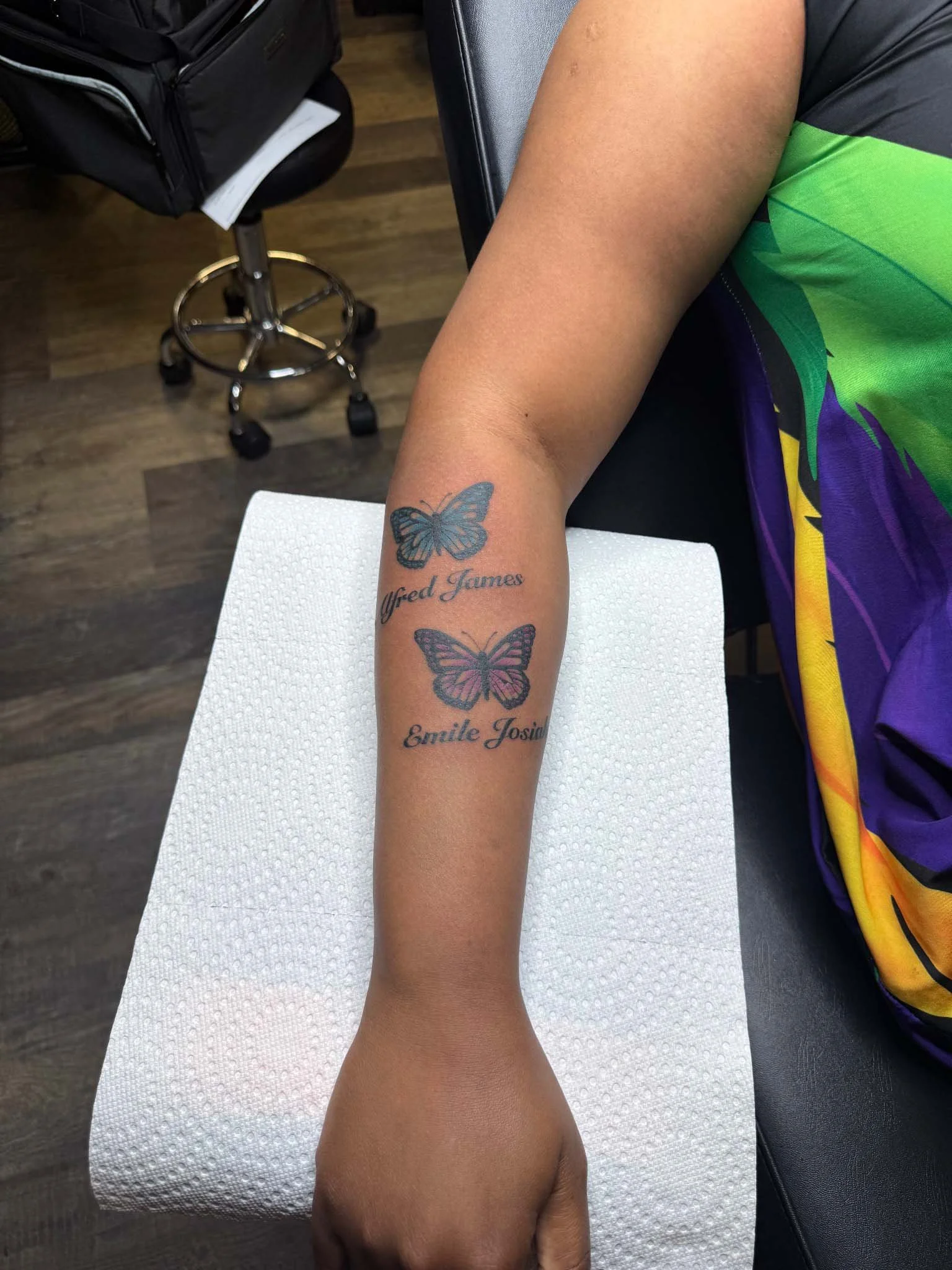 Butterfly tattoo in a person's forearm