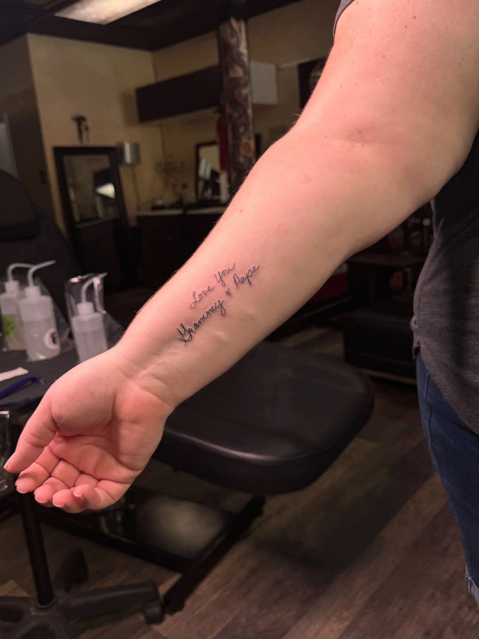 Script tattoo on a forearm