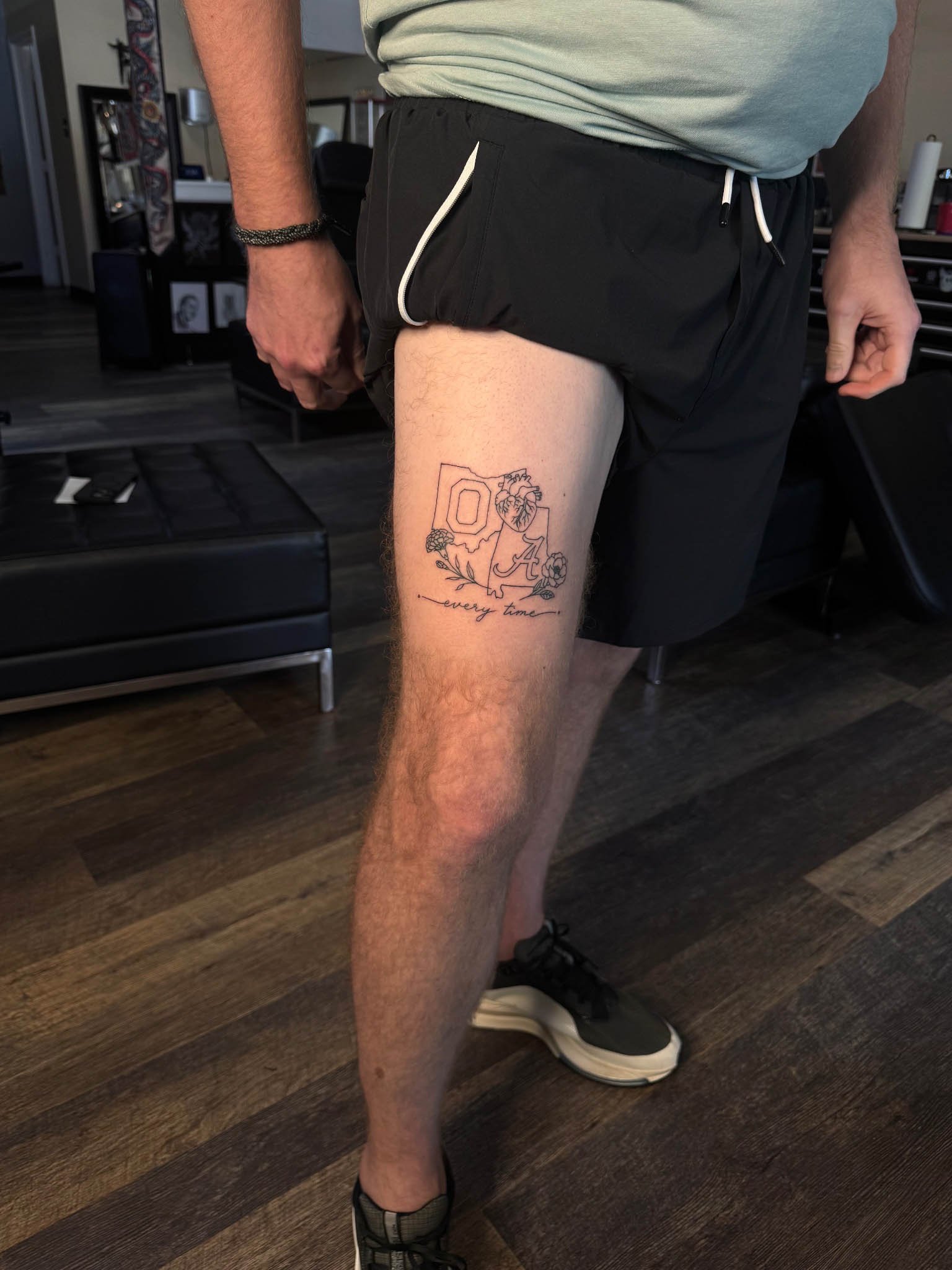 Flowers fine line tattoo on thighs