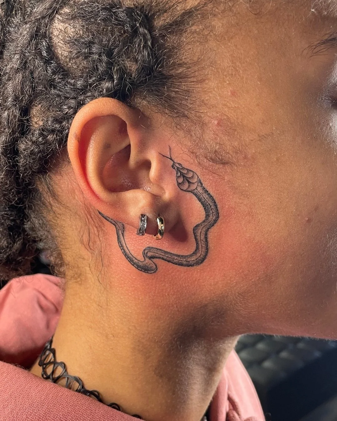 ear snake tattoo placement