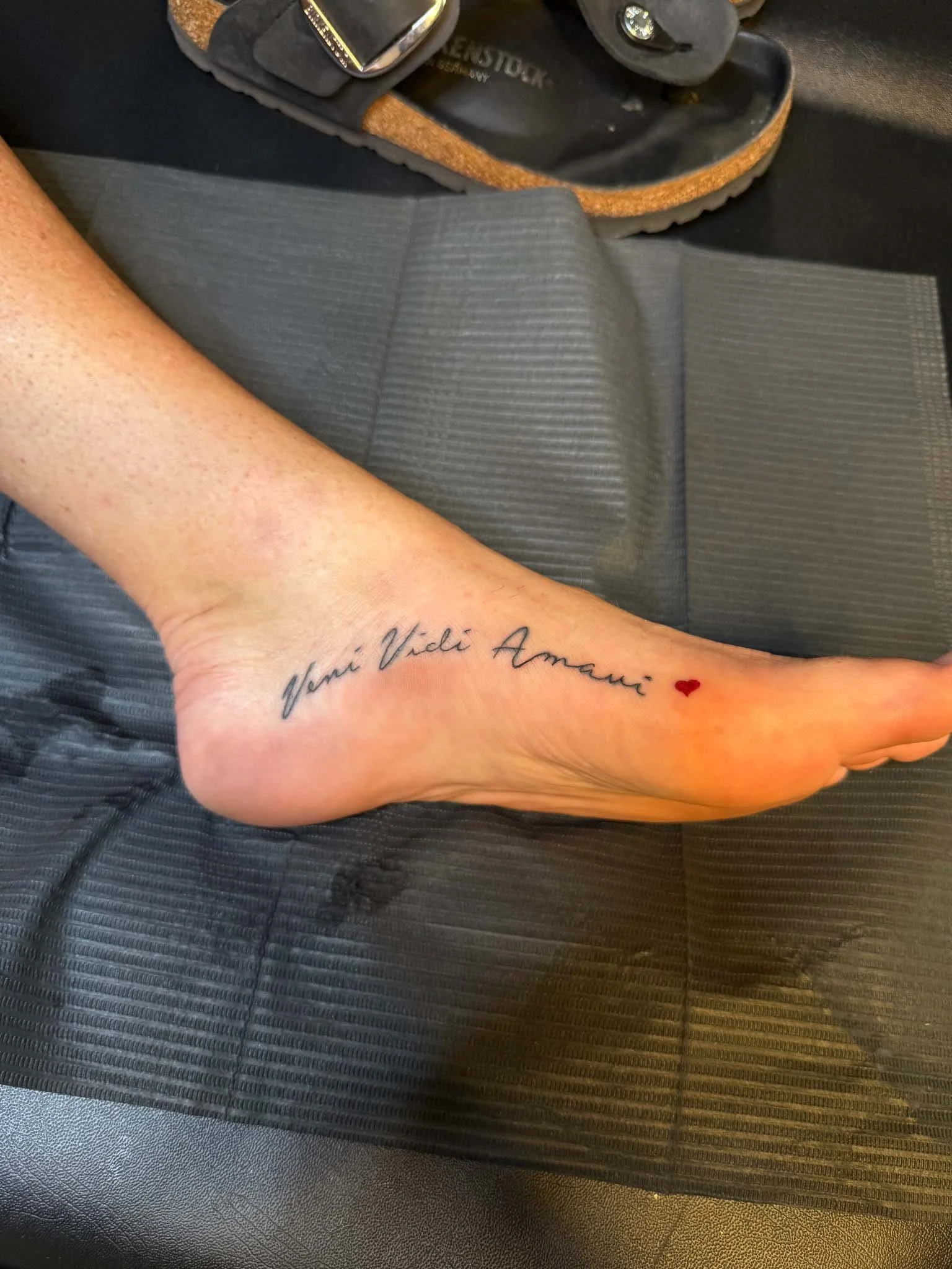 Fine-line tattoo on foot
