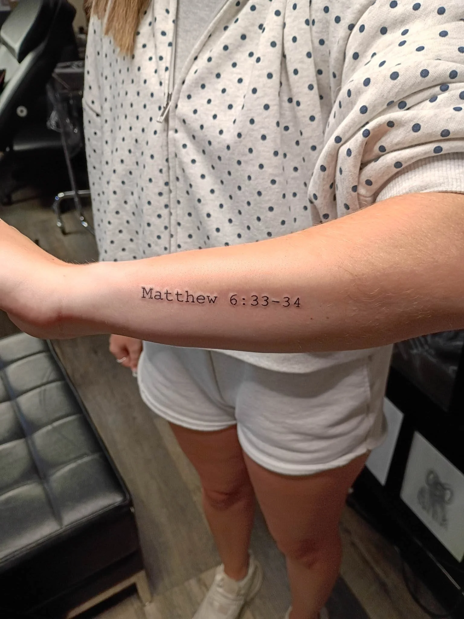 Fine-line tattoo on lower arm