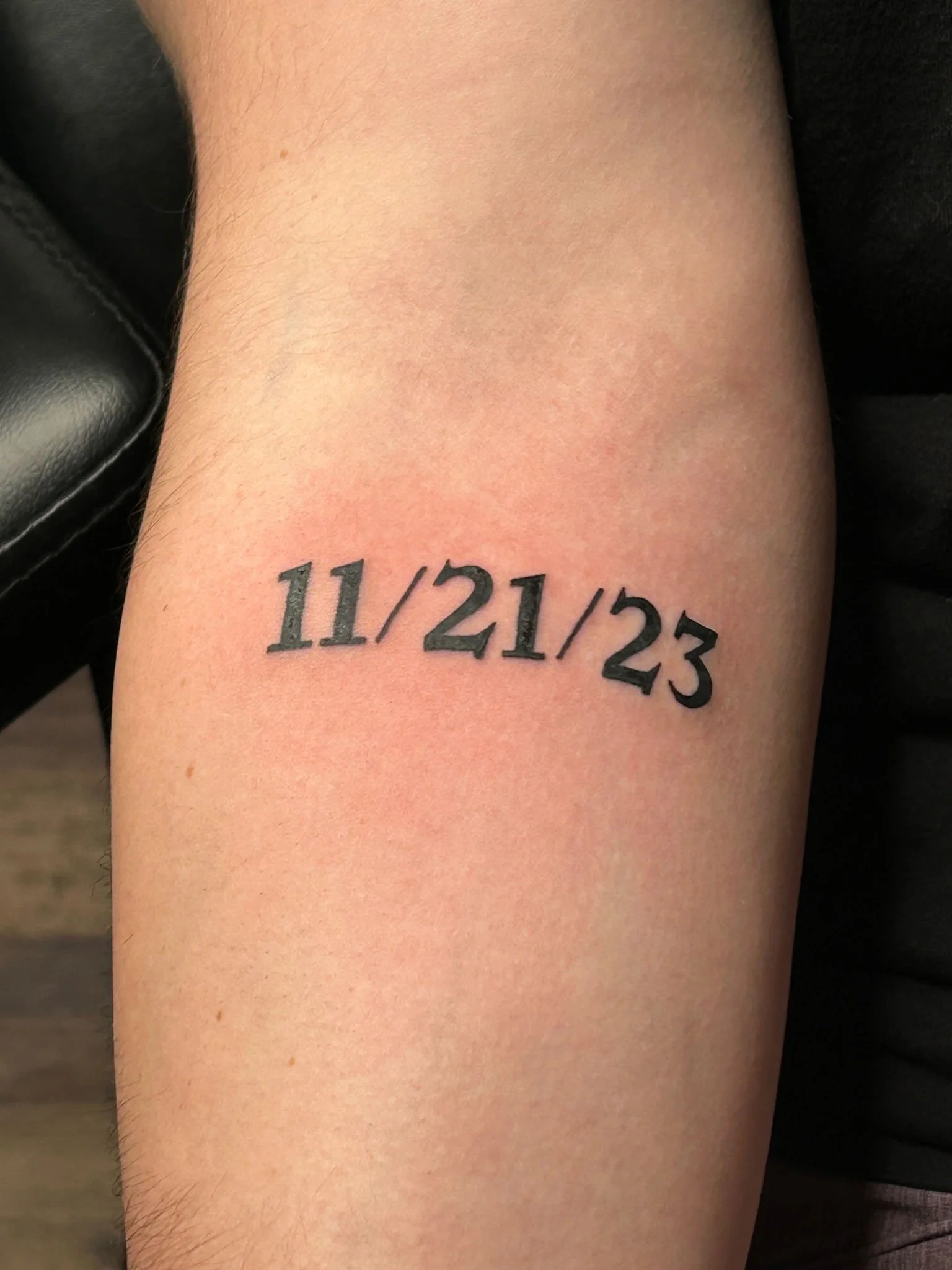 Numeric date tattoo inked on an arm