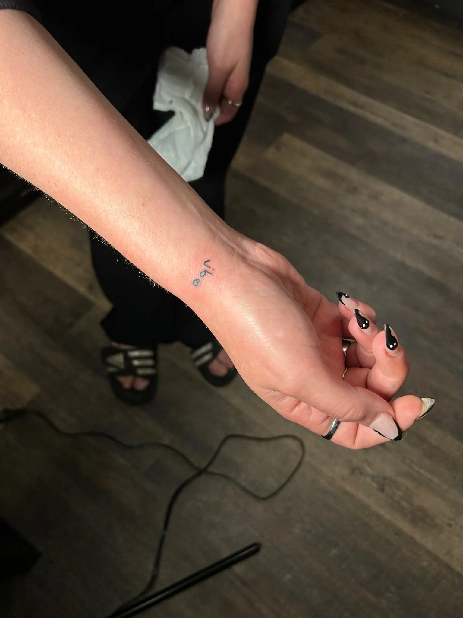 2026-10-05_TJ_BlackGray_Wrist_Fresh_Lettering.jpg