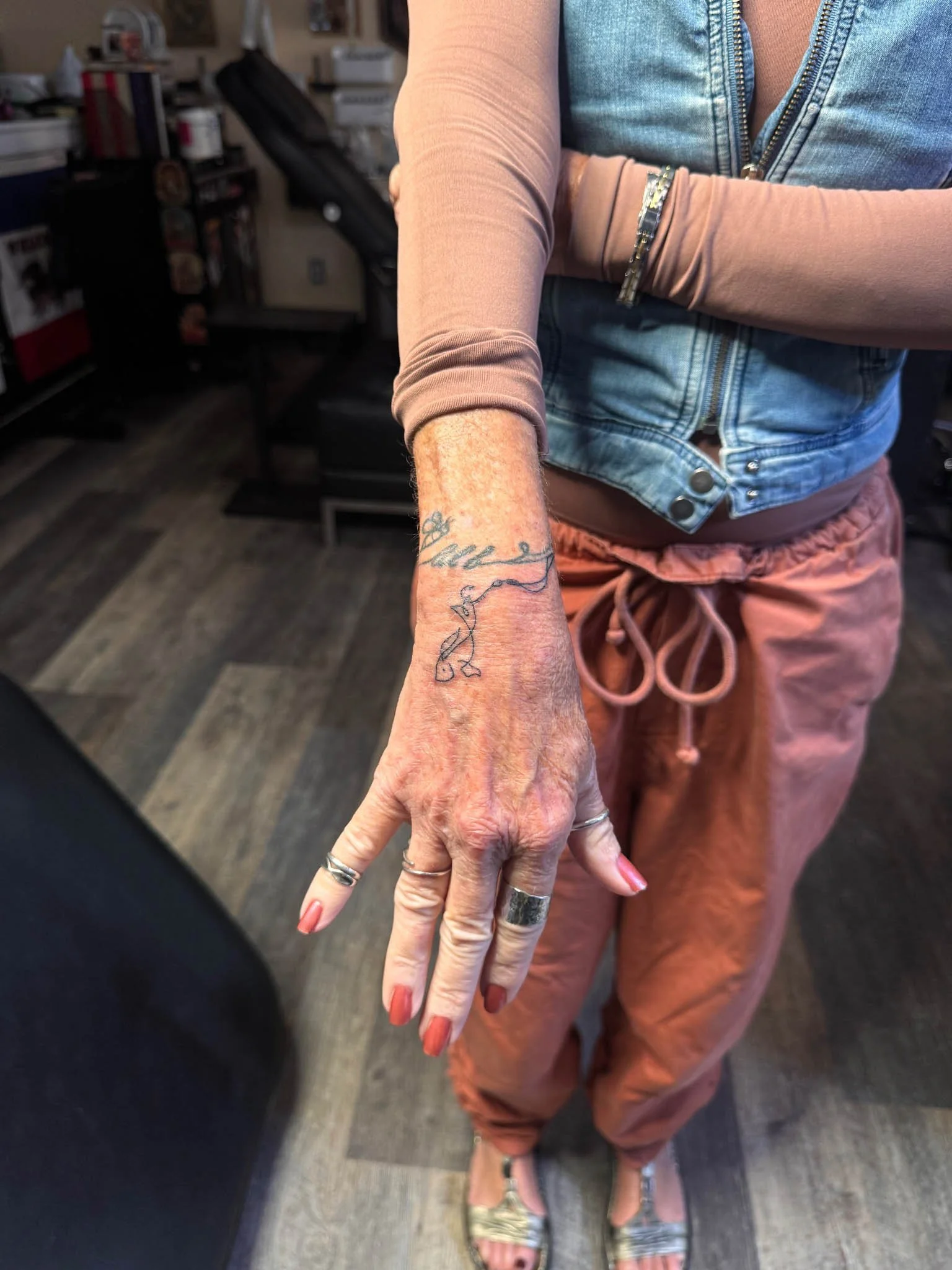 Fineline tattoo on hand