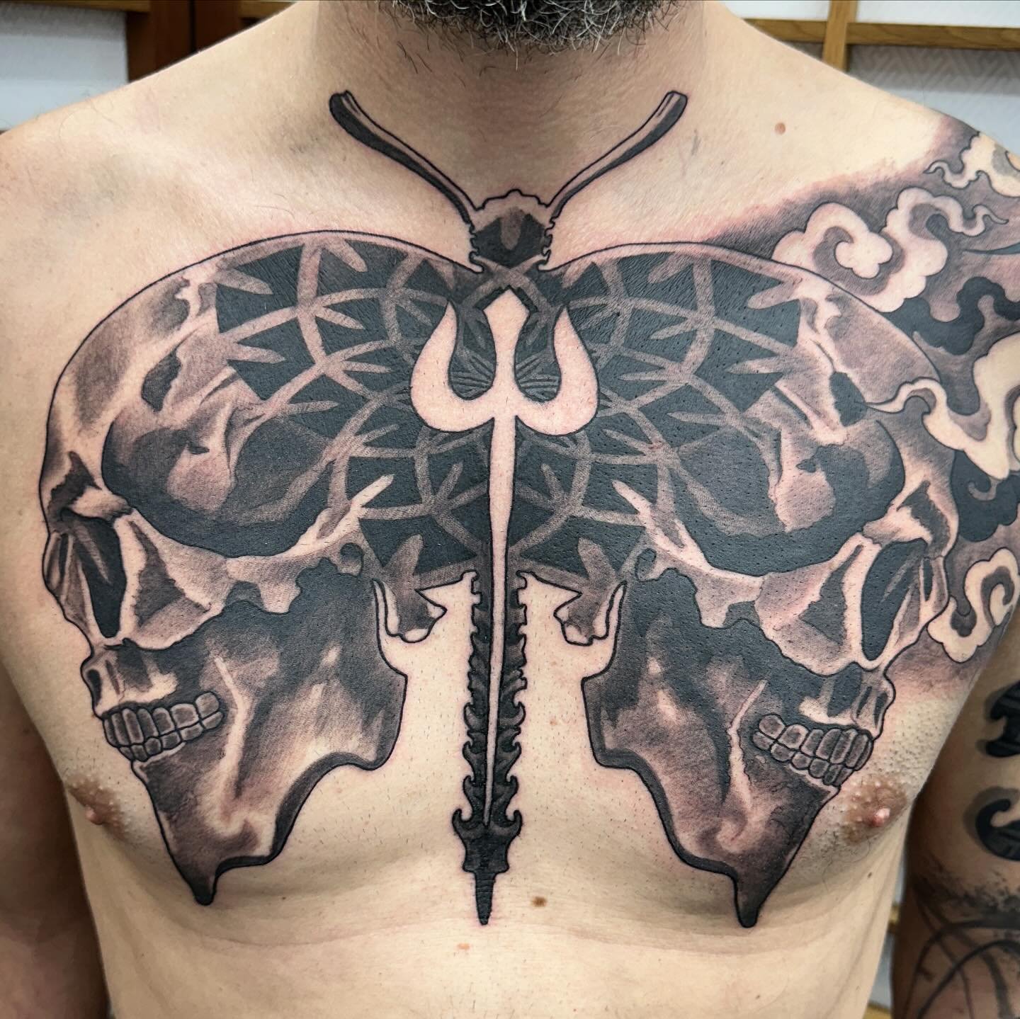 Skull moth chest tattoo inspired by an old diesel T-shirt design my client brought in. Done over 2 days with enough time to tidy up and add some colour to the cover-up we did on his arm in our last 2 day session.

BOOKINGS AVAILABLE 

Pay for your se