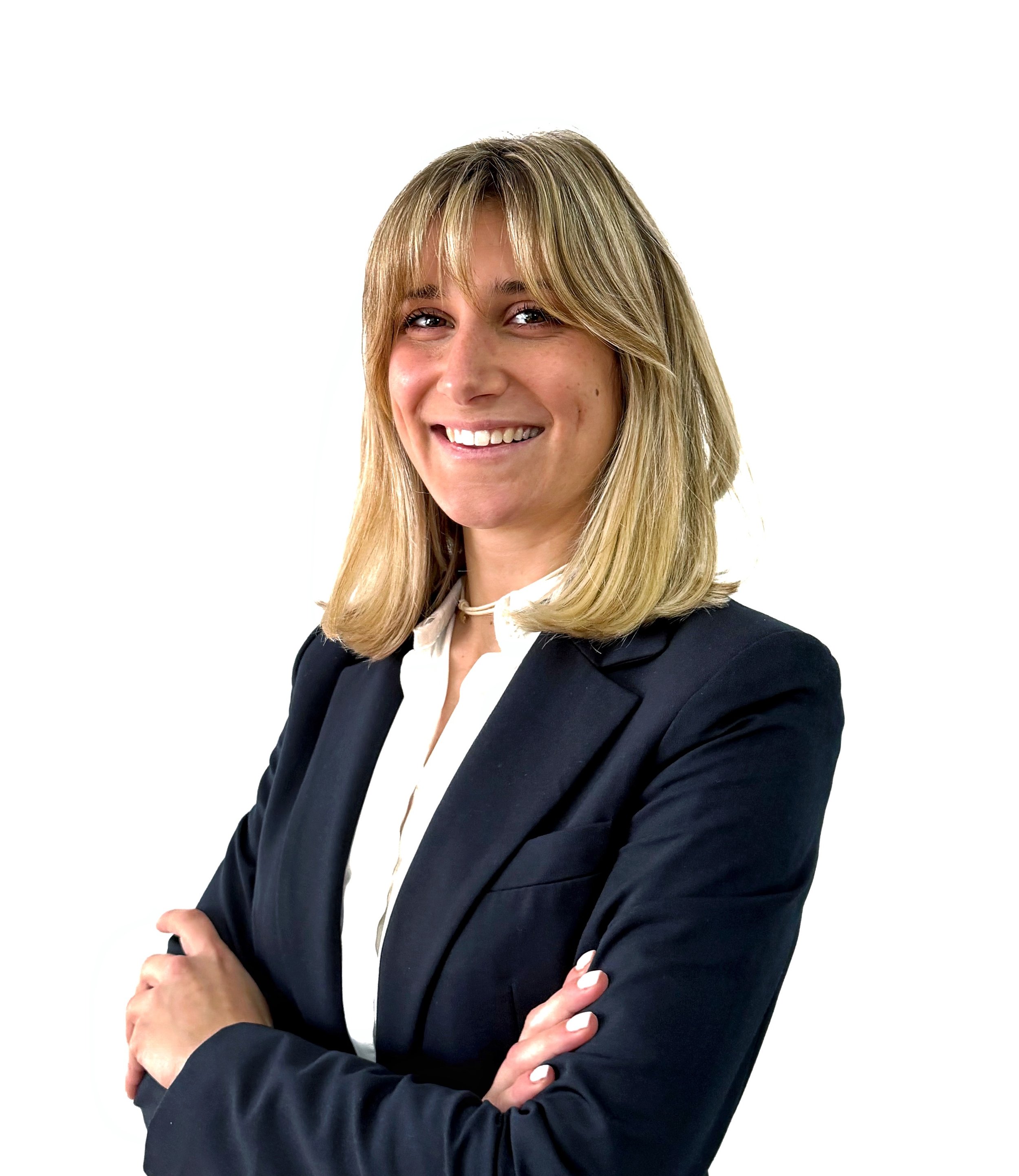 A tranquil winter landscape of snow-covered mountains and a frozen lake, reflecting the sky and surrounding mountains.