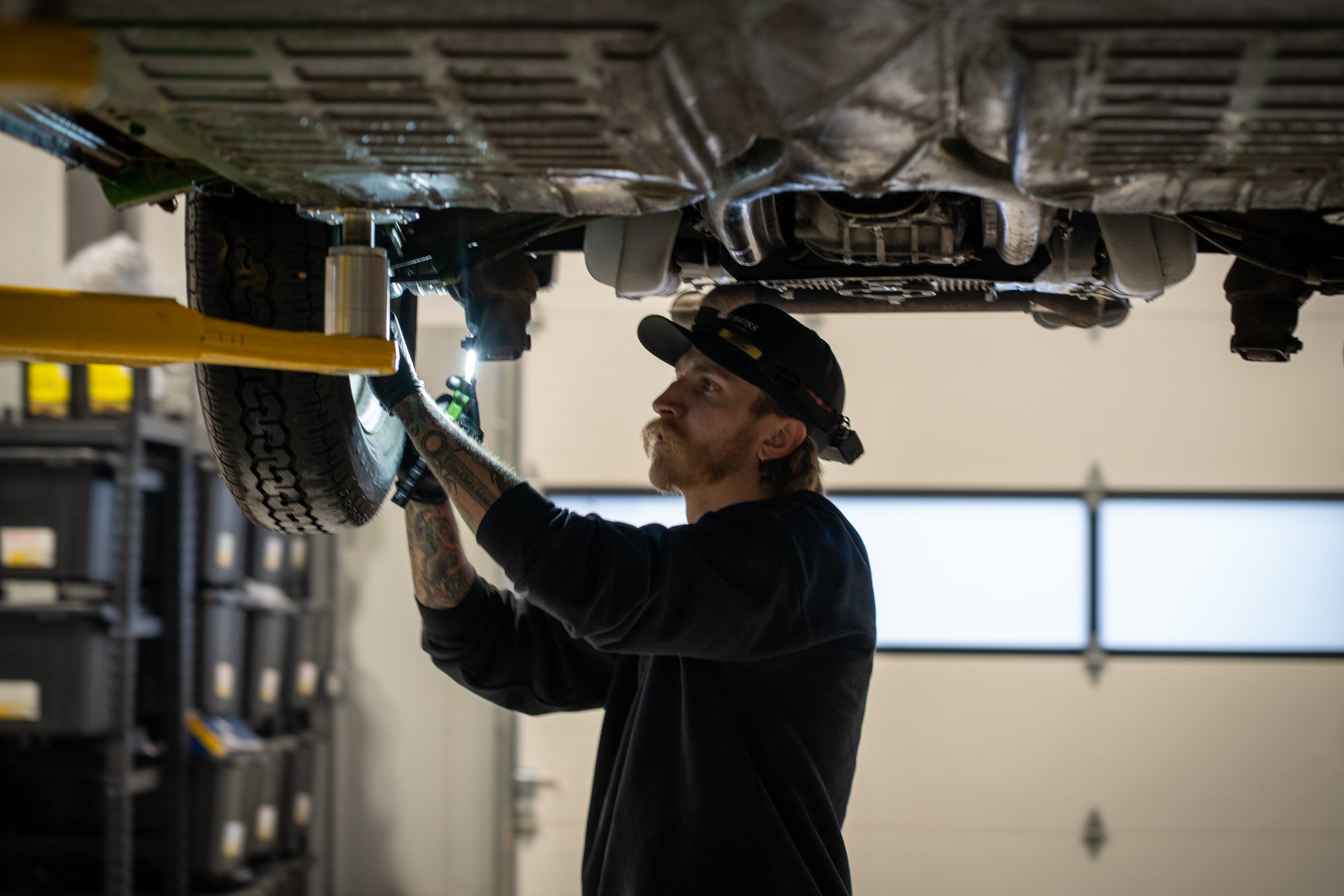 auto technician inspects a vintage Volkswagen