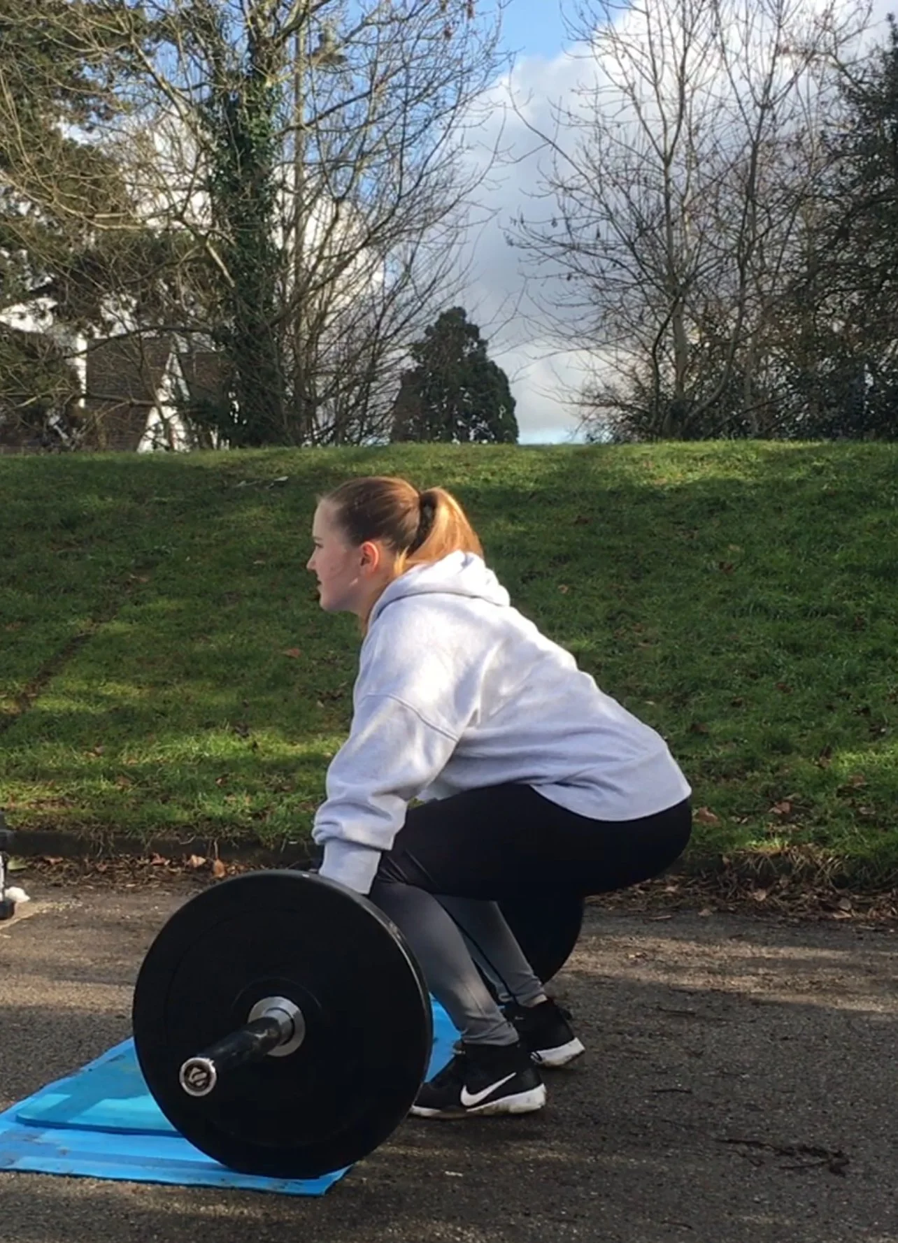Outdoor personal training in an open car park