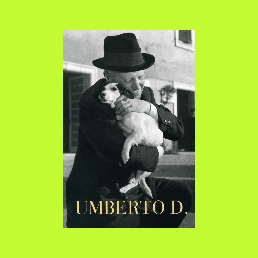 Black and white photo of a man hugging a dog, man wearing a suit and hat, name "Umberto D." written at the bottom.