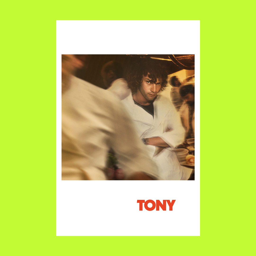 A movie poster for 'Tony' featuring a man with curly hair in a white chef's coat, arms crossed, surrounded by chefs in a busy kitchen.