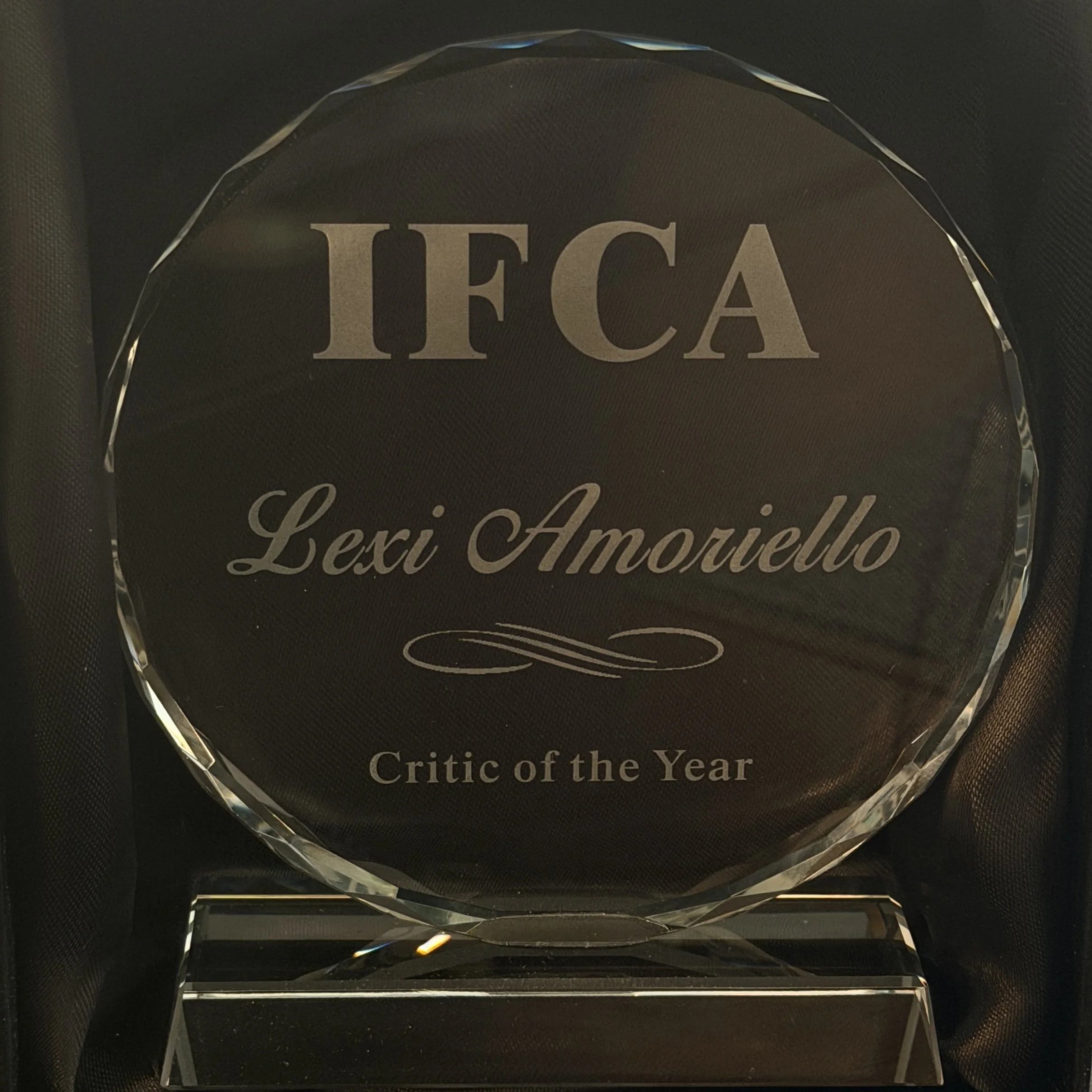 An award plaque shaped like a diamond with the word "IFCA" in large letters and the phrase "Critic of the Year" beneath it.