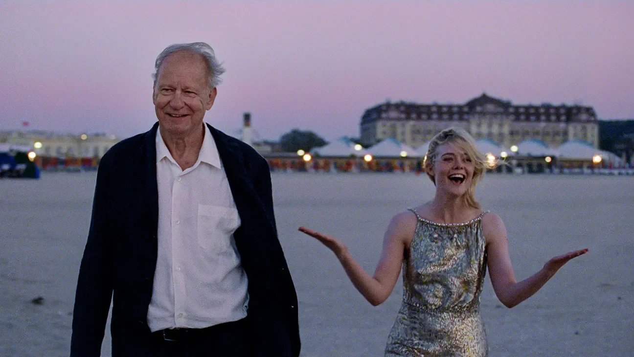 Stellan Skarsgard and Elle Fanning on the beach in Cannes in the film Sentimental Value
