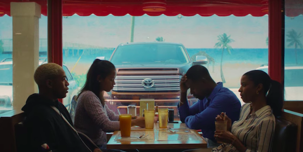 A family sitting at a diner