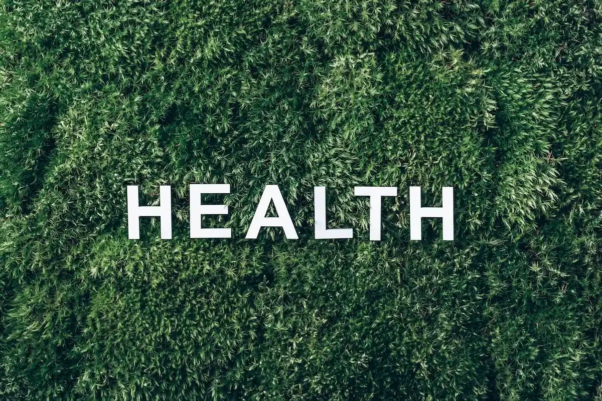 Health spelled out on a field of grass