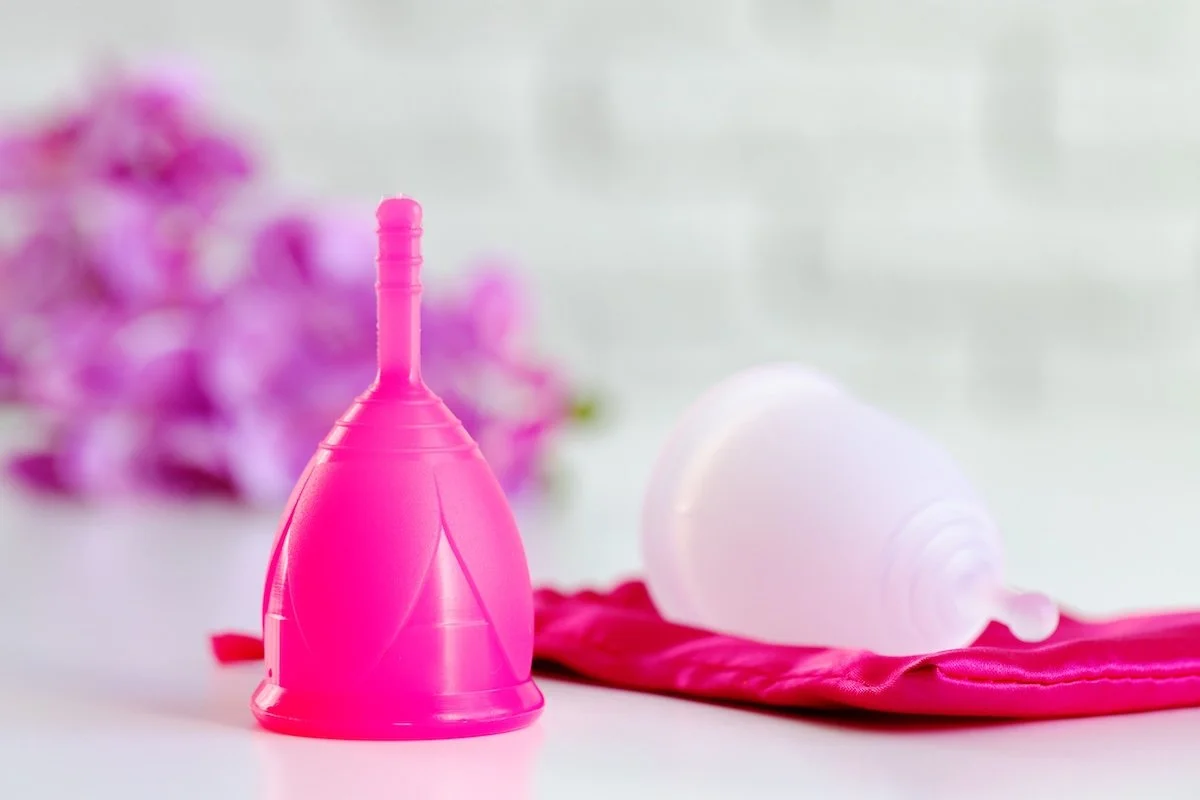 Two menstrual cups on a table.
