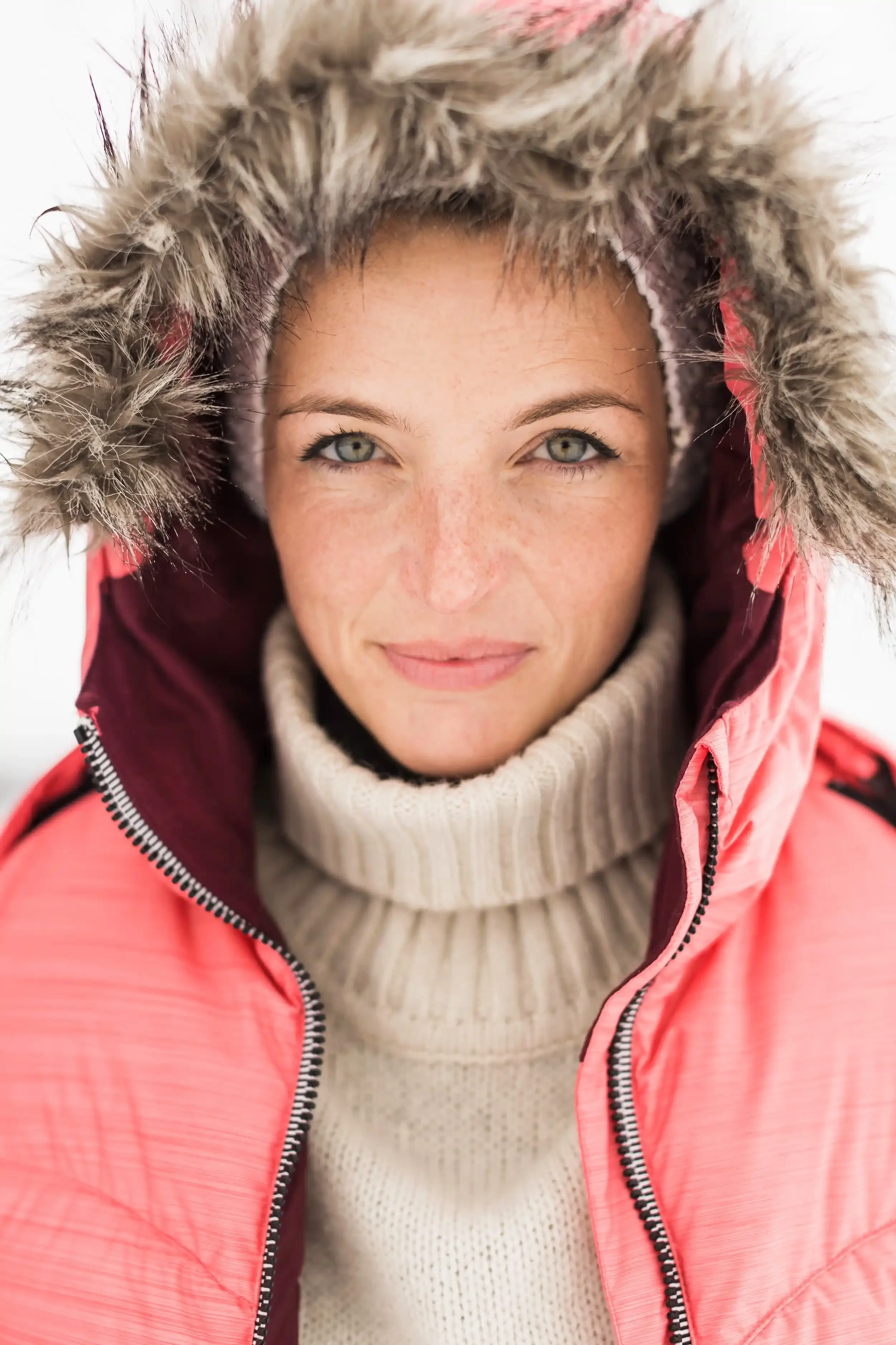 A woman wearing a fur-trimmed parka.