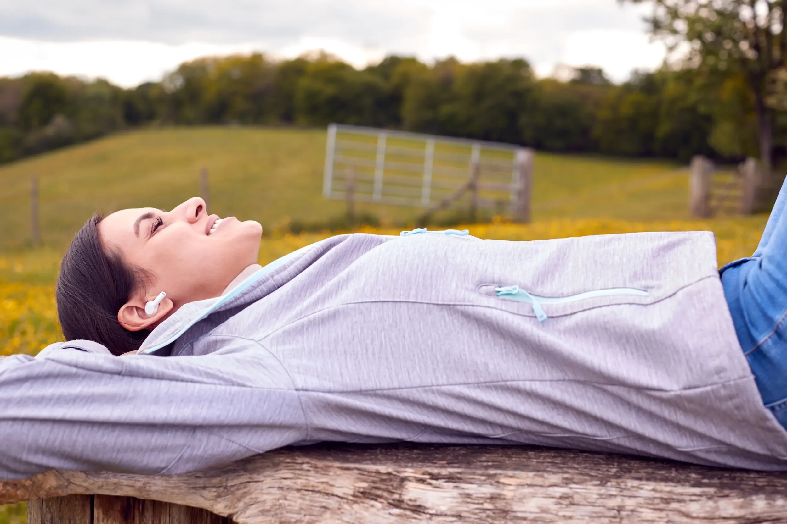 A woman relaxing outdoors.