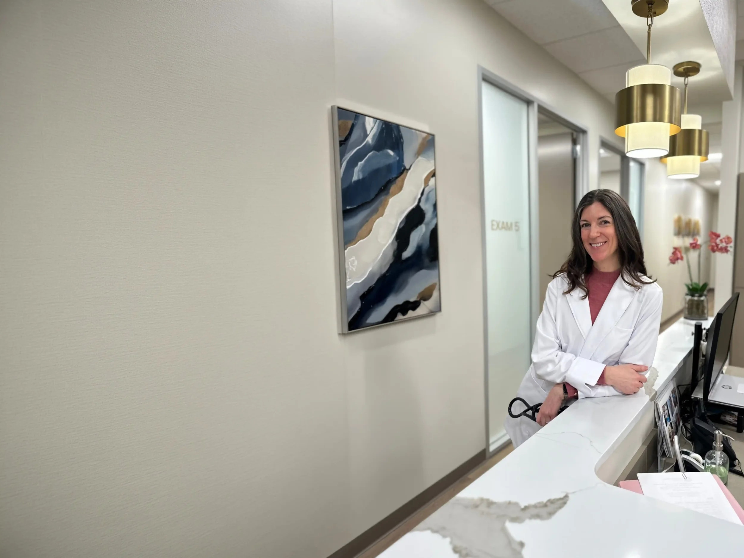 Dr. Jill Casey, MD, IBCLC at the Trillium Concierge Medicine front desk in Edmonds, WA