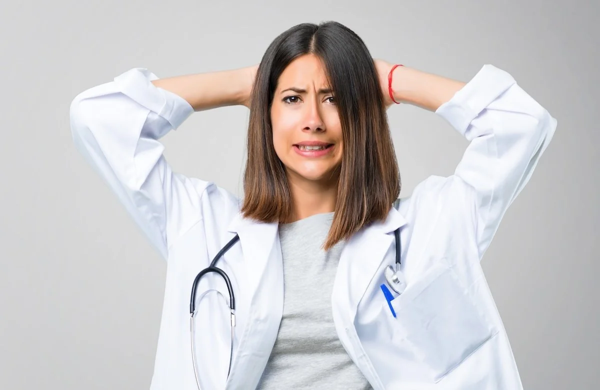 A female doctor looking frustrated.