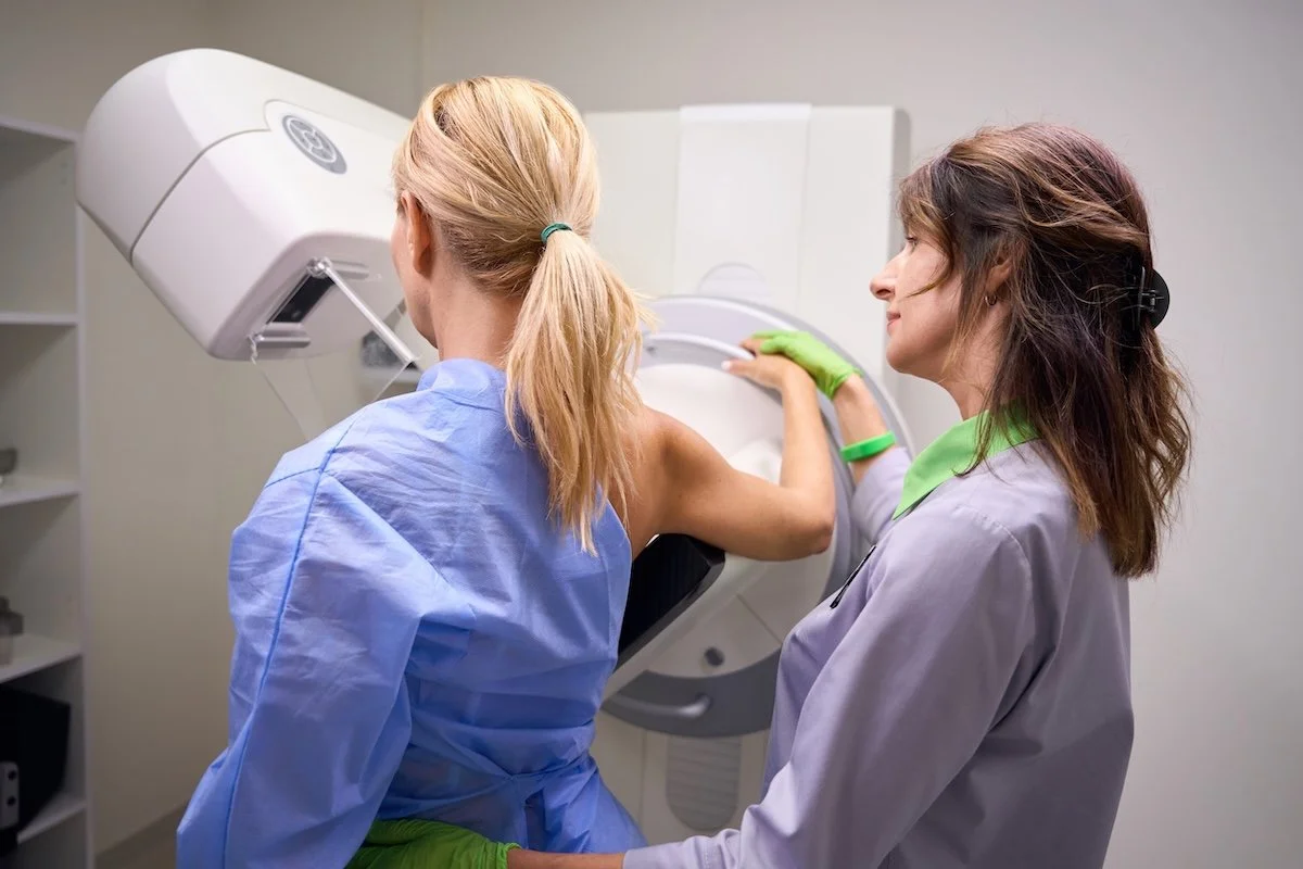 A woman having a mammogram