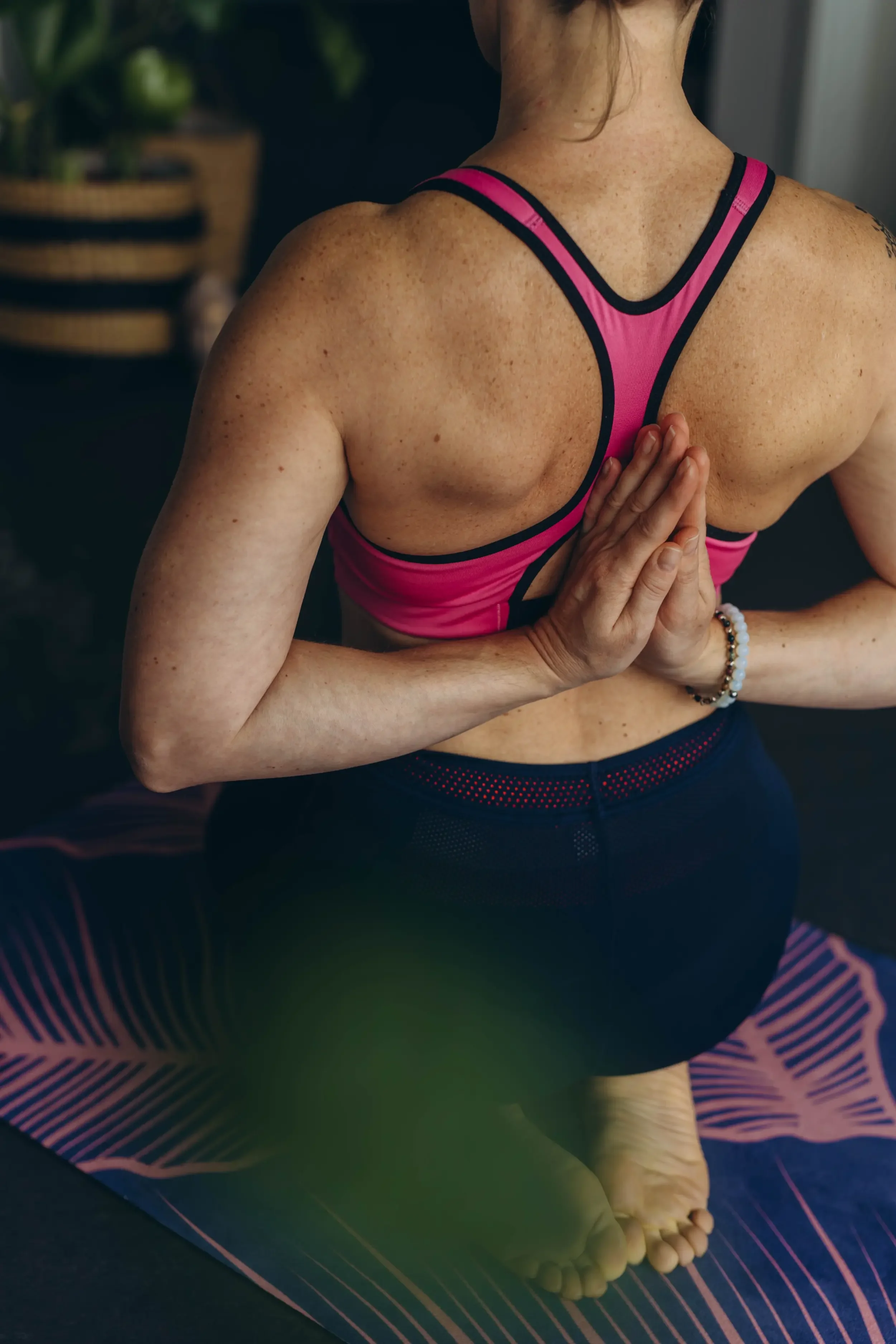A woman doing yoga to combat stress.