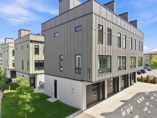 Modern multi-unit condominium building with metal panel siding in Traverse City