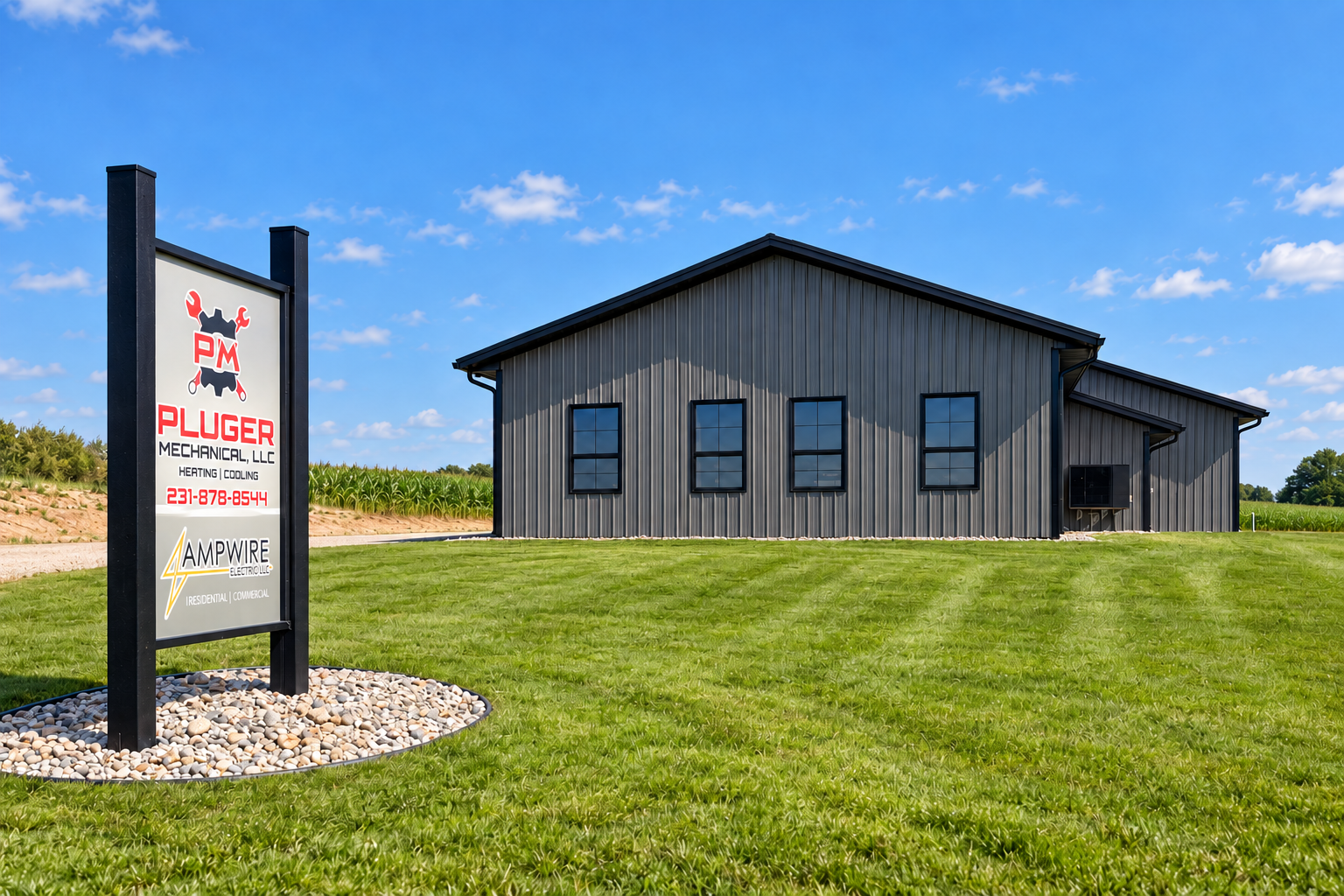 Steel-sided post-frame pole building with sign out front on a Michigan lot