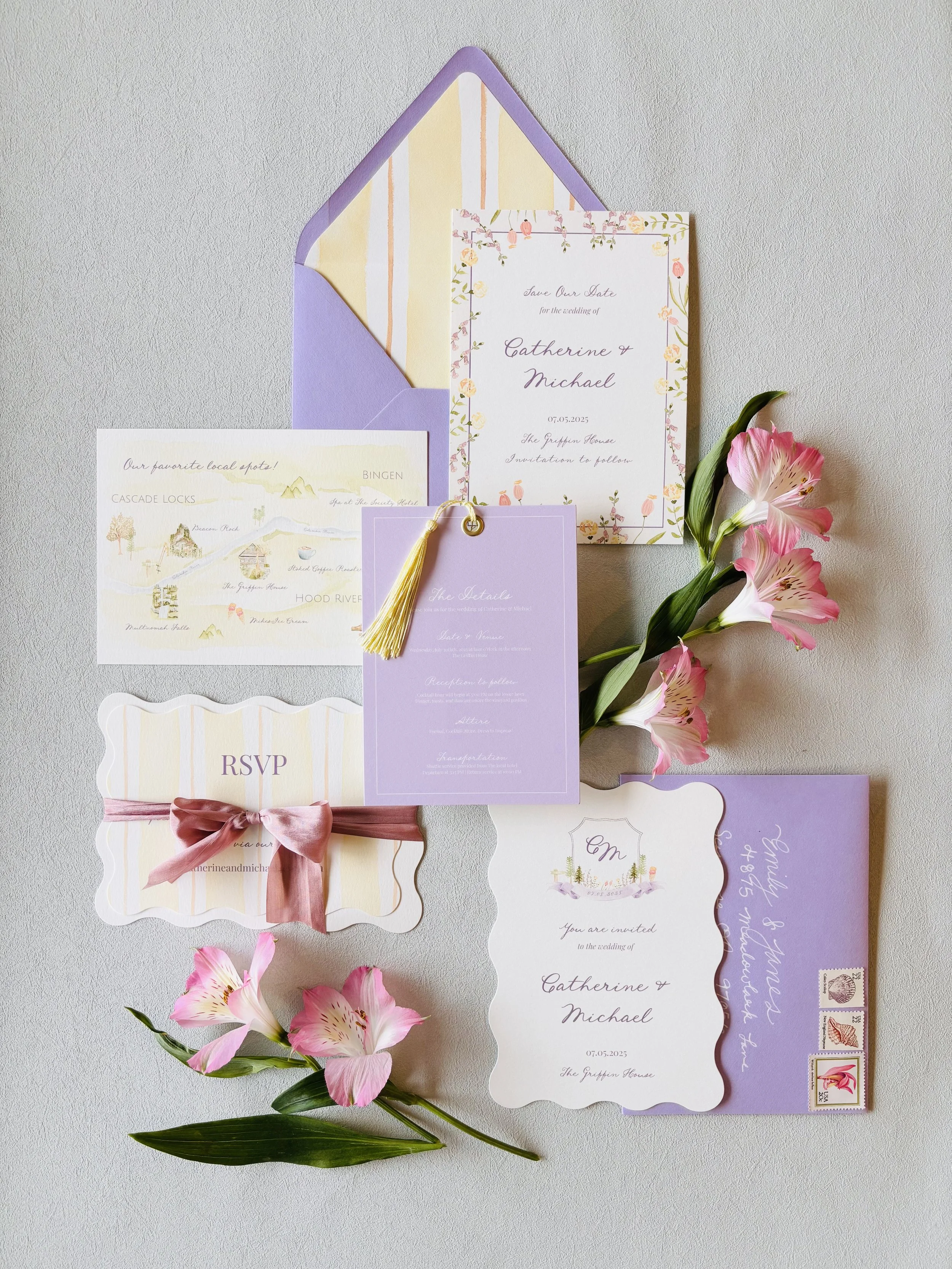 Collection of wedding invitations and RSVP cards in pastel colors with pink flowers and green leaves.