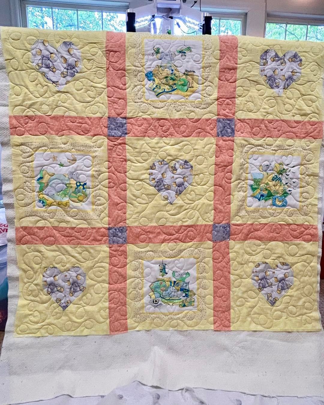 A sweet baby quilt pieced by Sarah G.! She wanted this quilt freemotion quilted with loops and hearts!  I will do a simple freemotion design on quilts for a reduced cost (1.5 cents per square inch)! 

 #granvilleohioquilters #longarmleague #granville