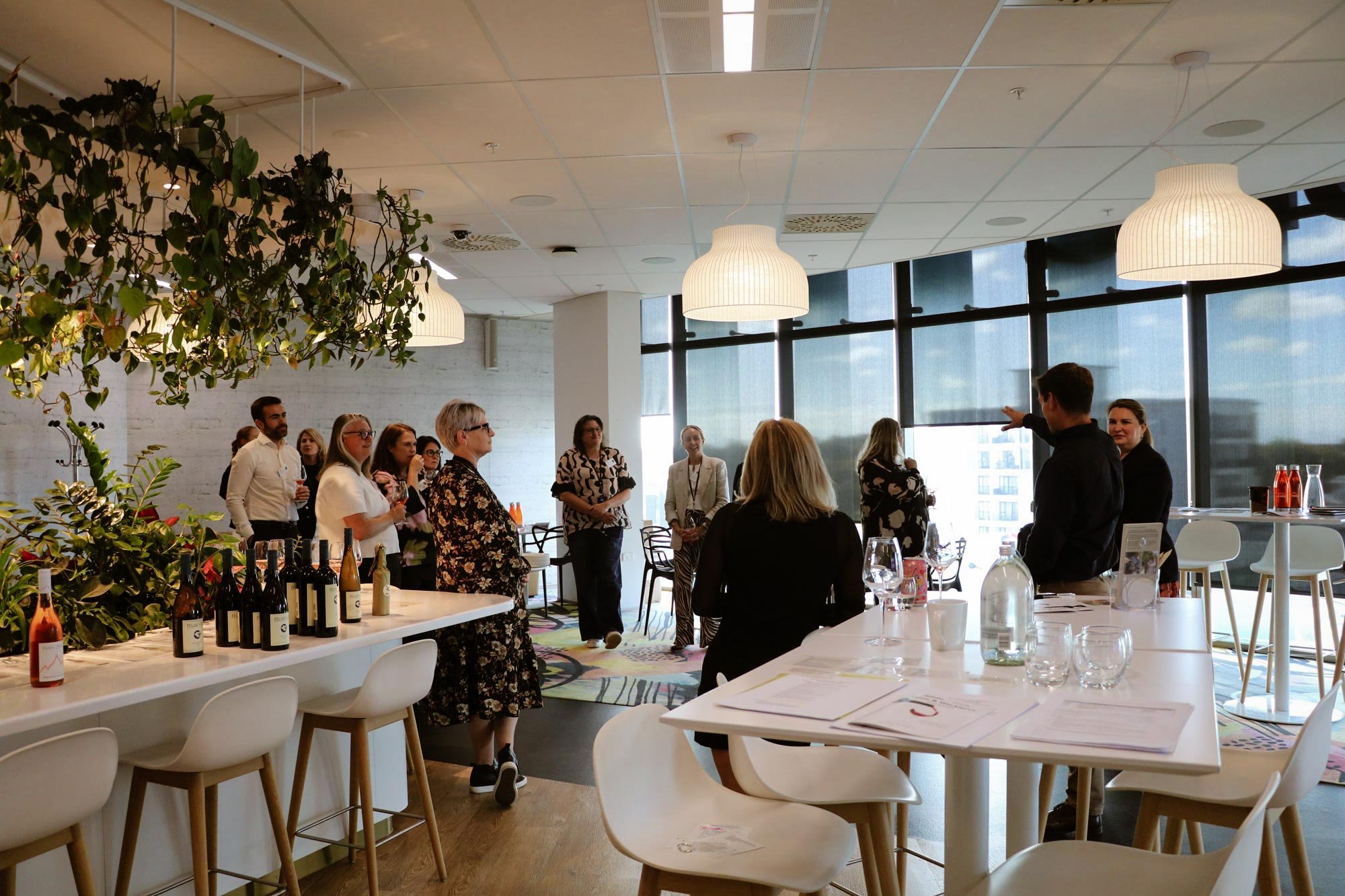 Corporate events - pouring wine at sunset