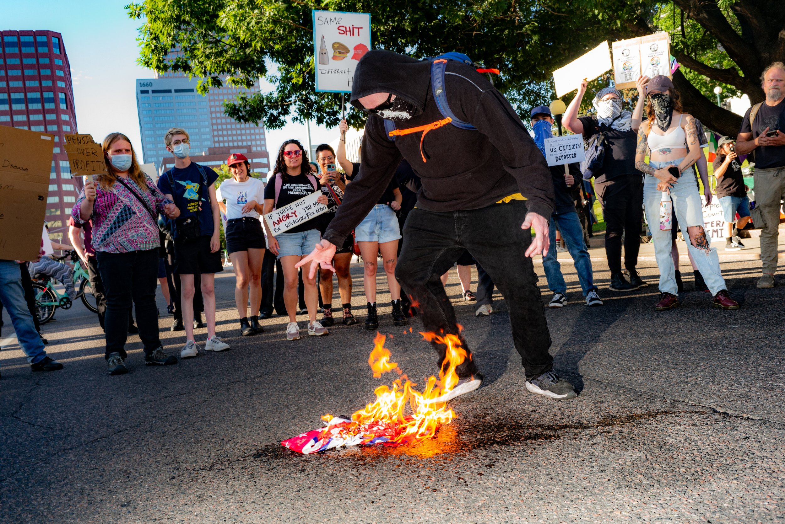 American flag burns at Anti-Fascism demonstration, Denver, 2025