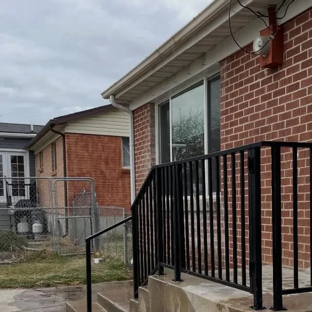 Step railing, brick home
