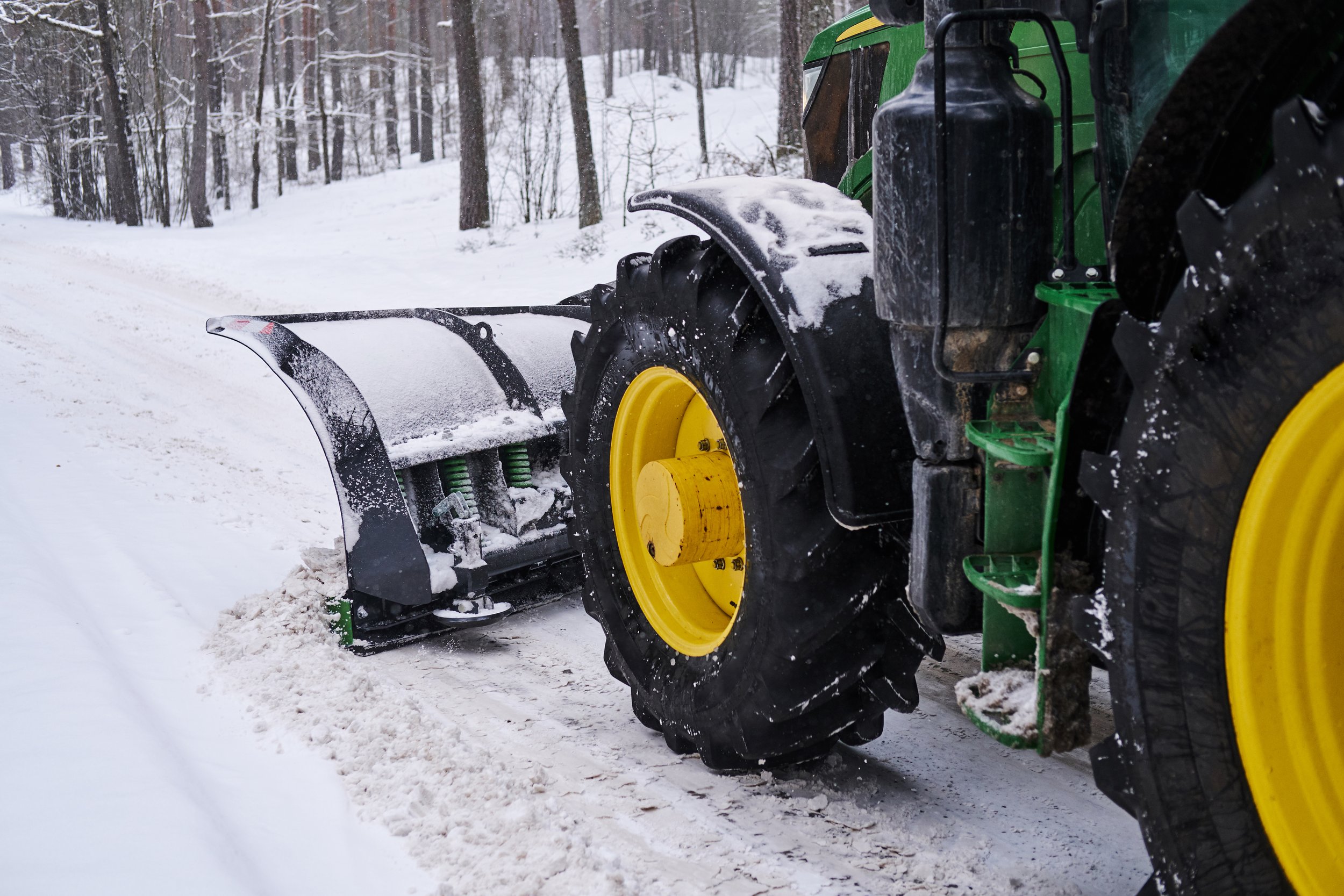 big-special-tractor-is-removing-snow-from-forestal-road.jpg