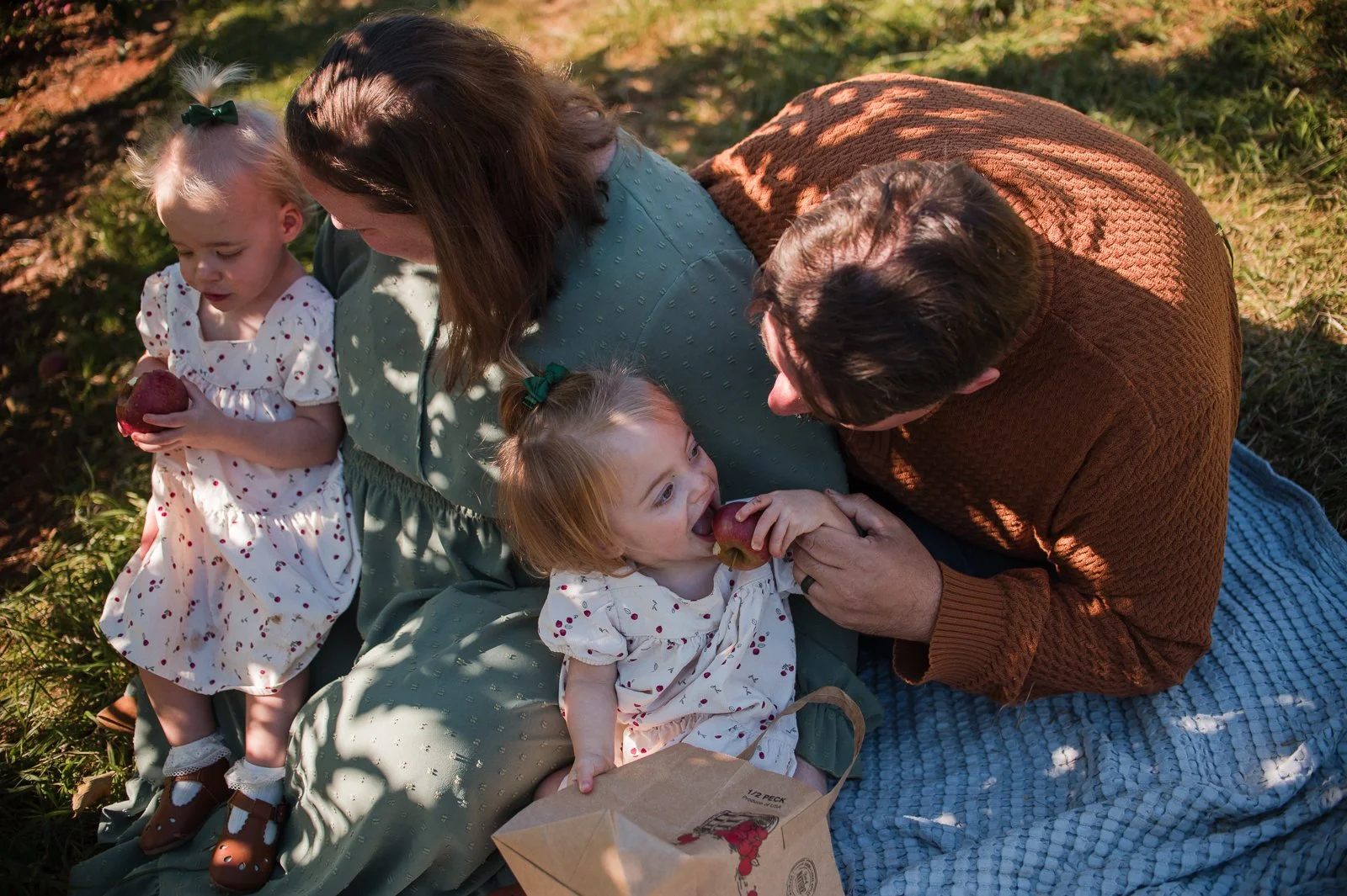 erin-e-gallagher-photography-family-chiles-peach-orchard-fall-eating-apples-noon-cville.jpg