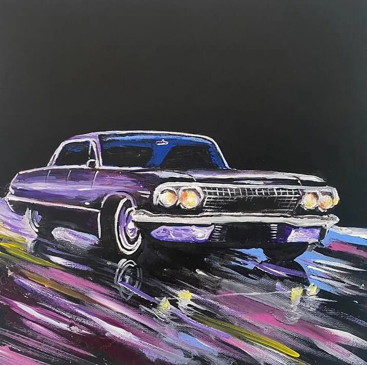 pre | 1961 Chevrolet Impala, illuminated by streaks of colour and night reflections.