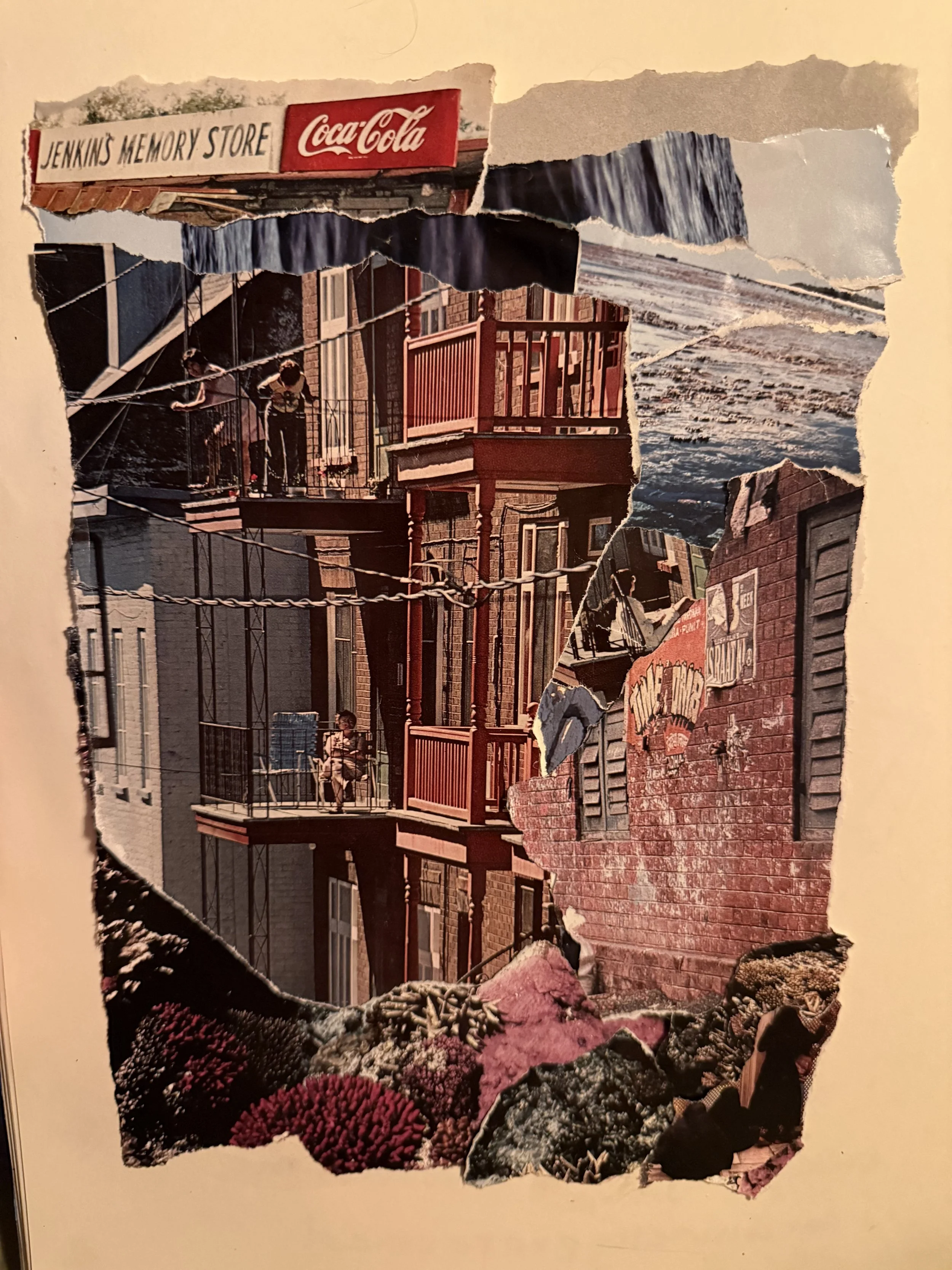 A collage made of torn pieces of a photograph showing a street scene with buildings, balconies, and a red brick sidewalk, along with flowers and rocks at the bottom.