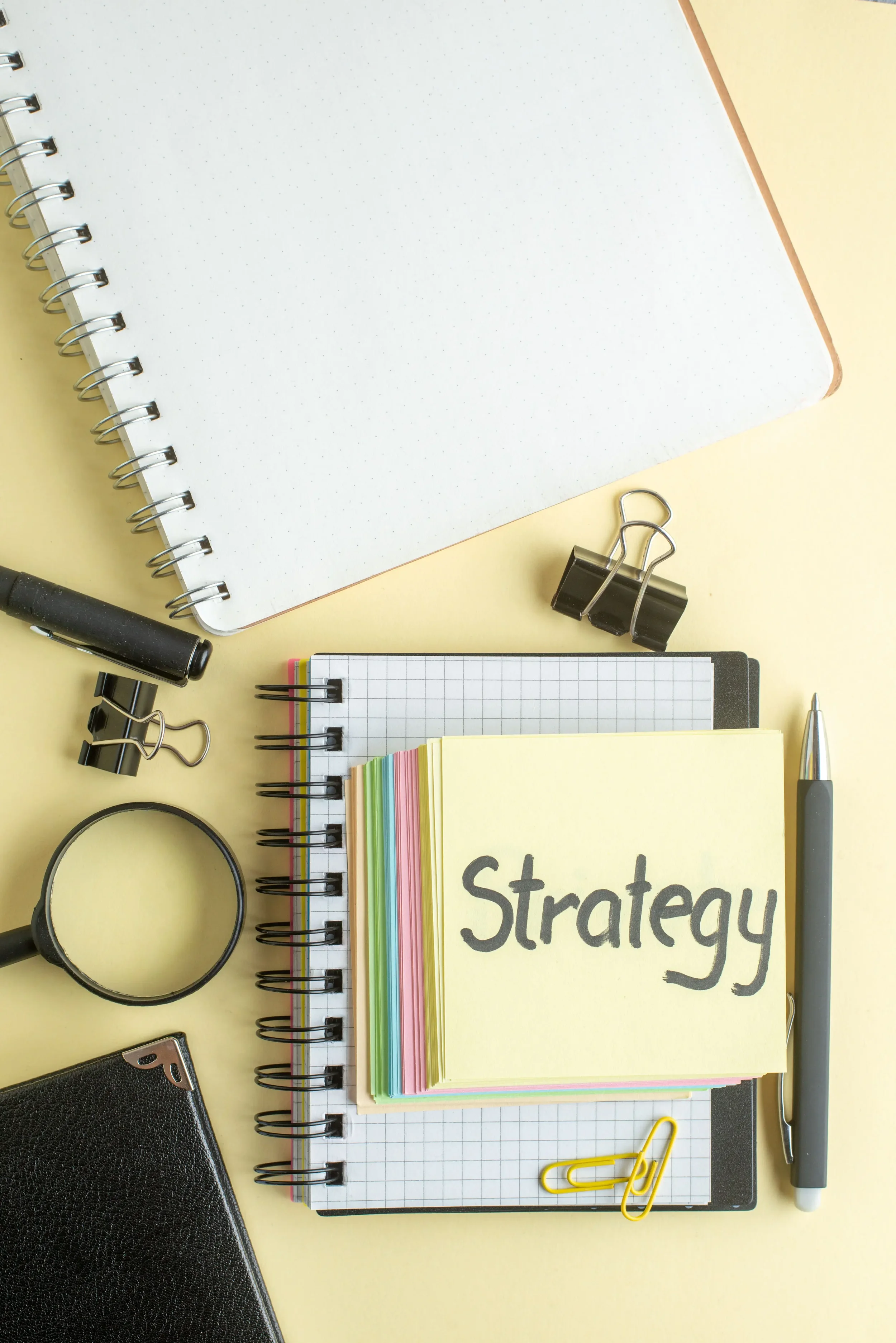 A sticky note with the word strategy written on it - The Private Practice Pro