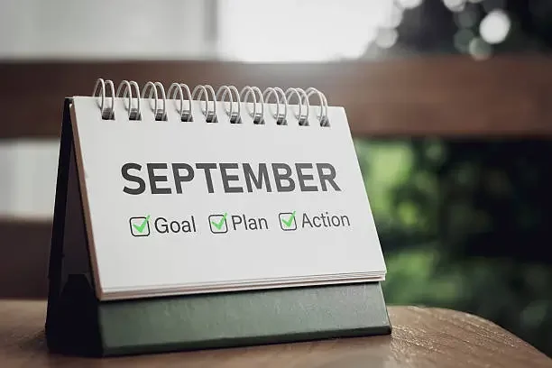September desk calendar with goal, plan, and action checkboxes representing a 30-day fall referral marketing plan for therapists. 