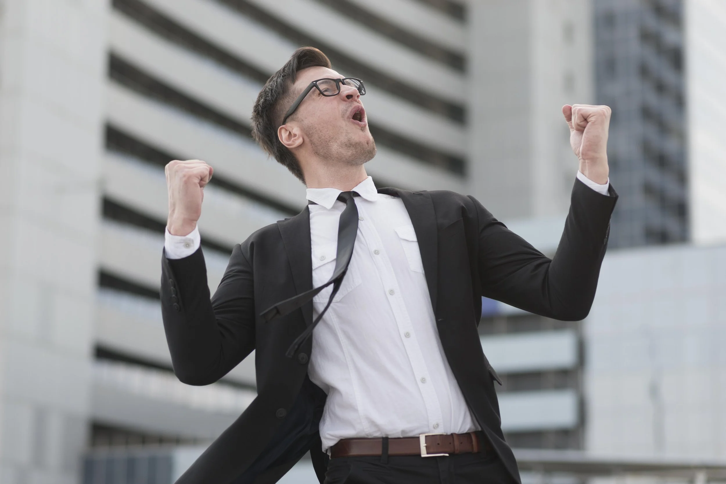 A man celebrating his success in therapy practice.