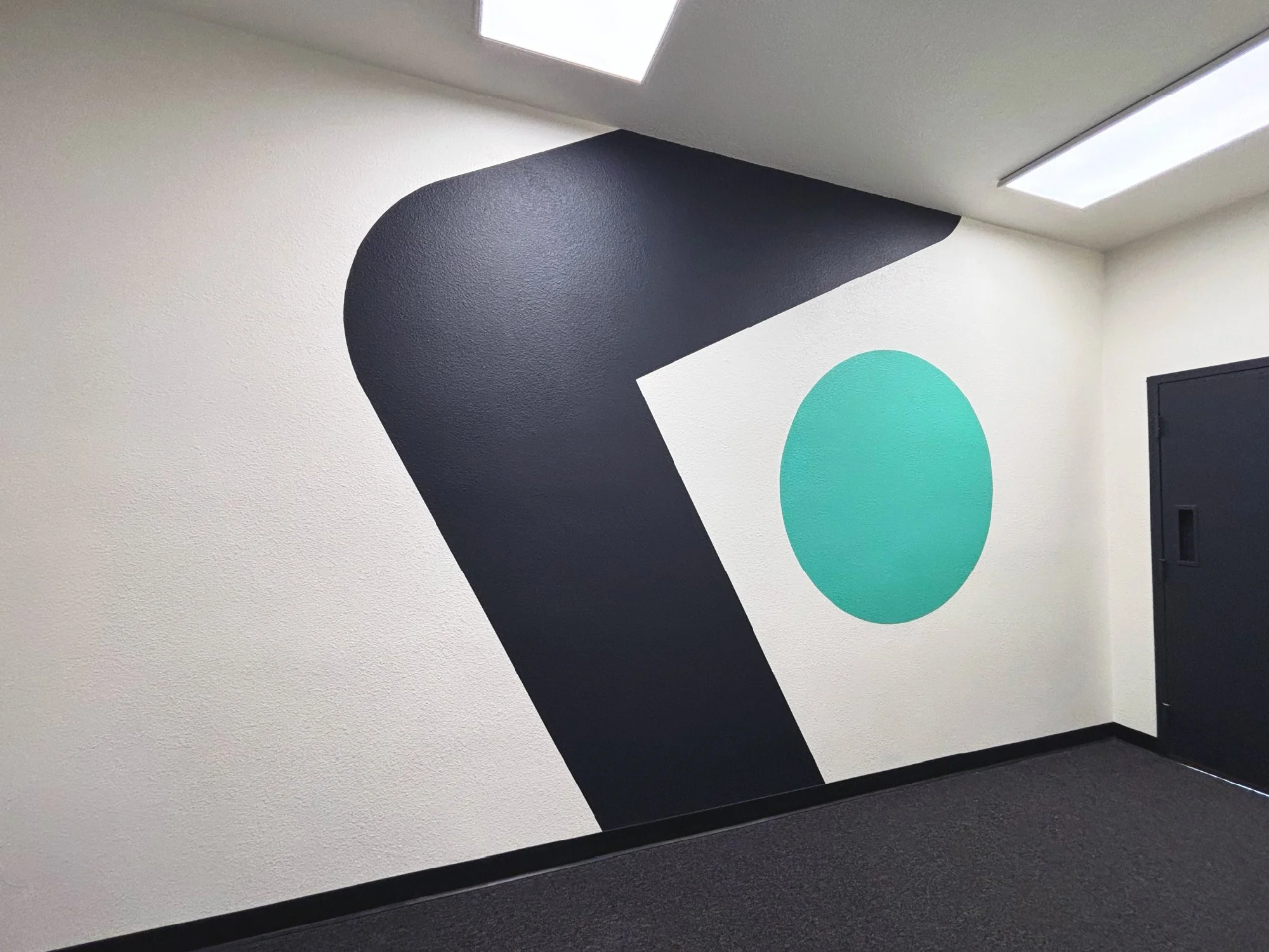 Family Leadership Inc. office wall graphic featuring large-scale branded environmental design elements.