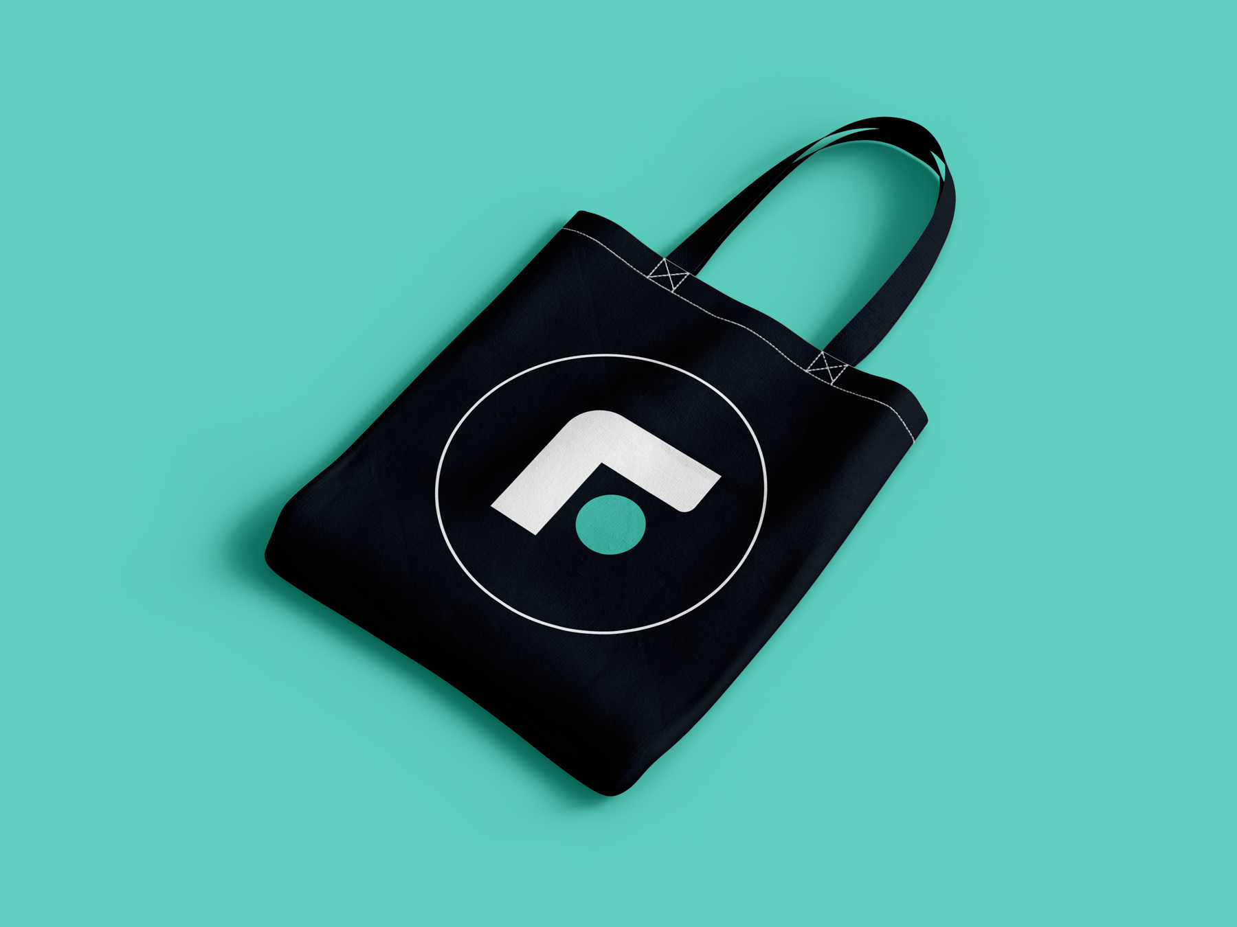 Family Leadership Inc. branded tote bag featuring the organization's logo and brand identity system.