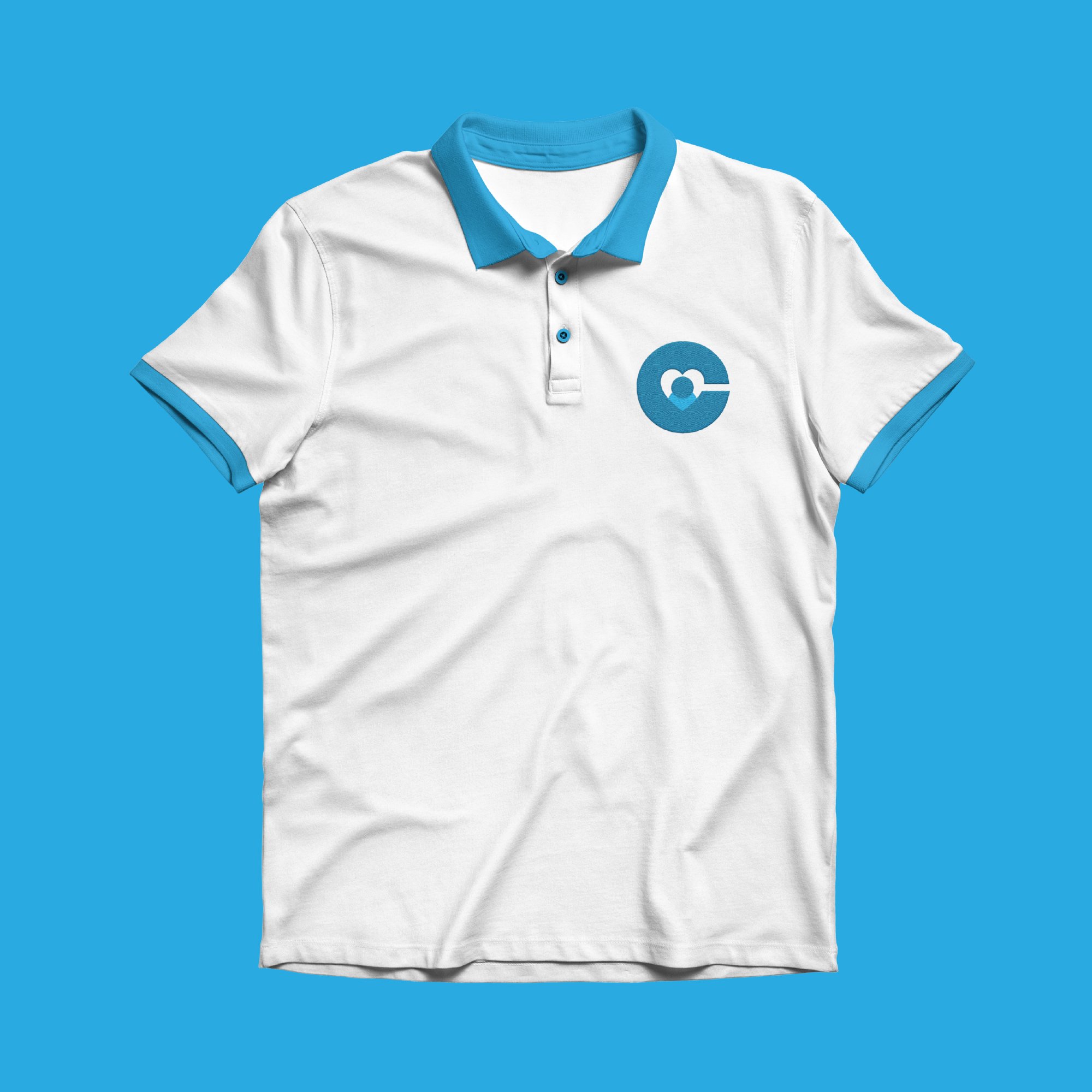 White Calm & Kind Family polo shirt featuring the organization's logo and branded apparel design.