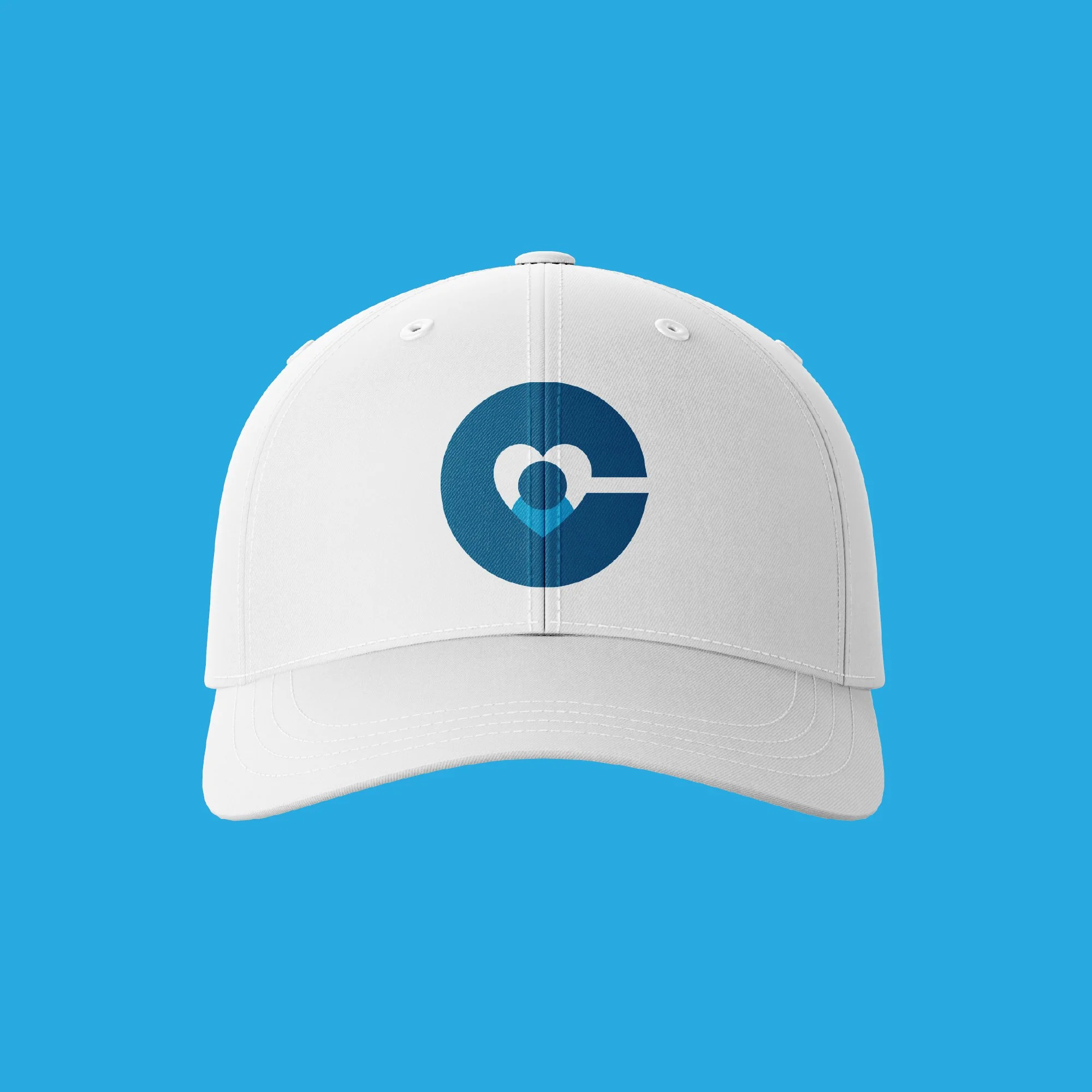 Close-up of a white baseball cap with a blue circular logo on the front, set against a bright blue background.