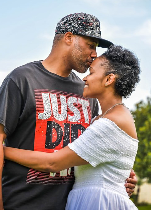 Married couple husband kissing wife at intensive counseling