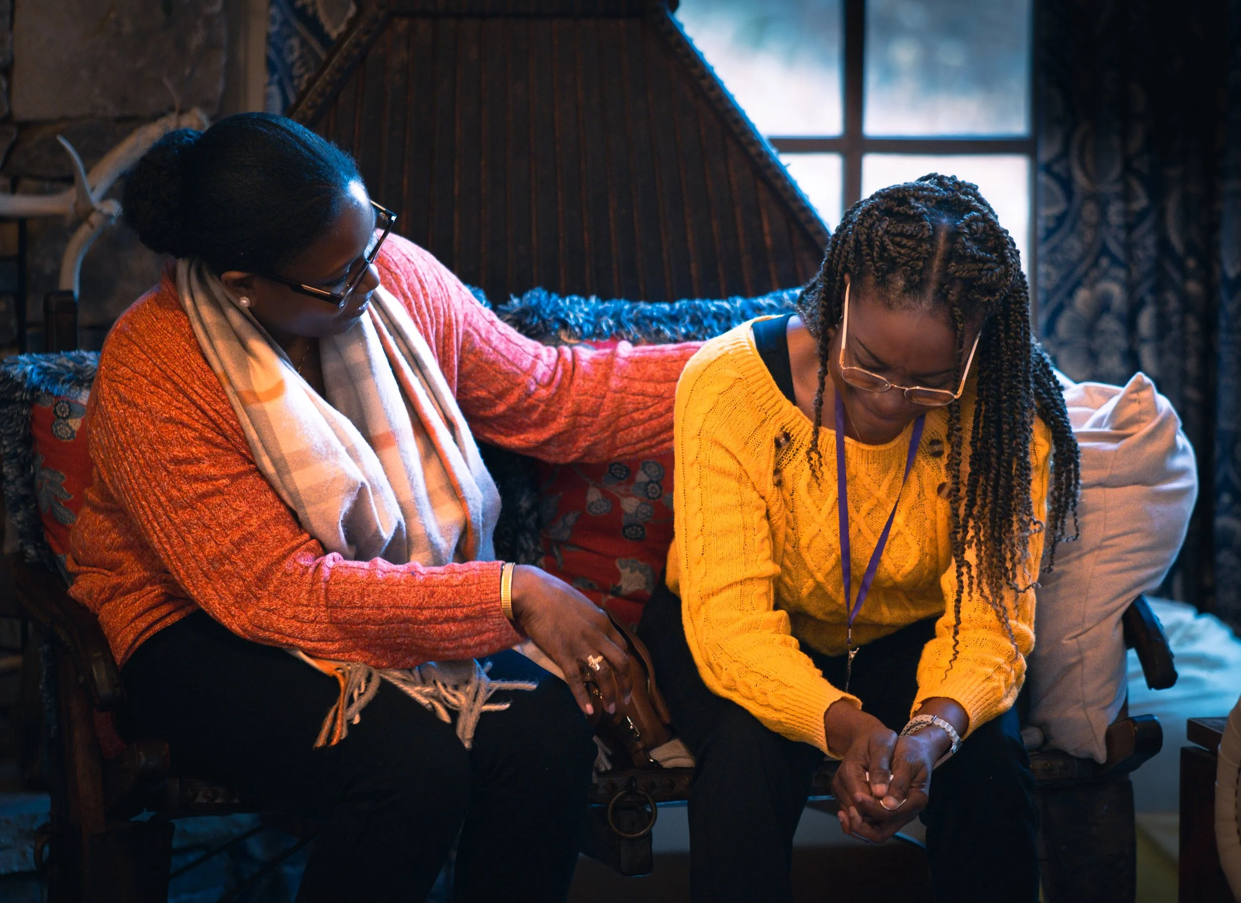 black therapist in atlanta comforting client during therapy