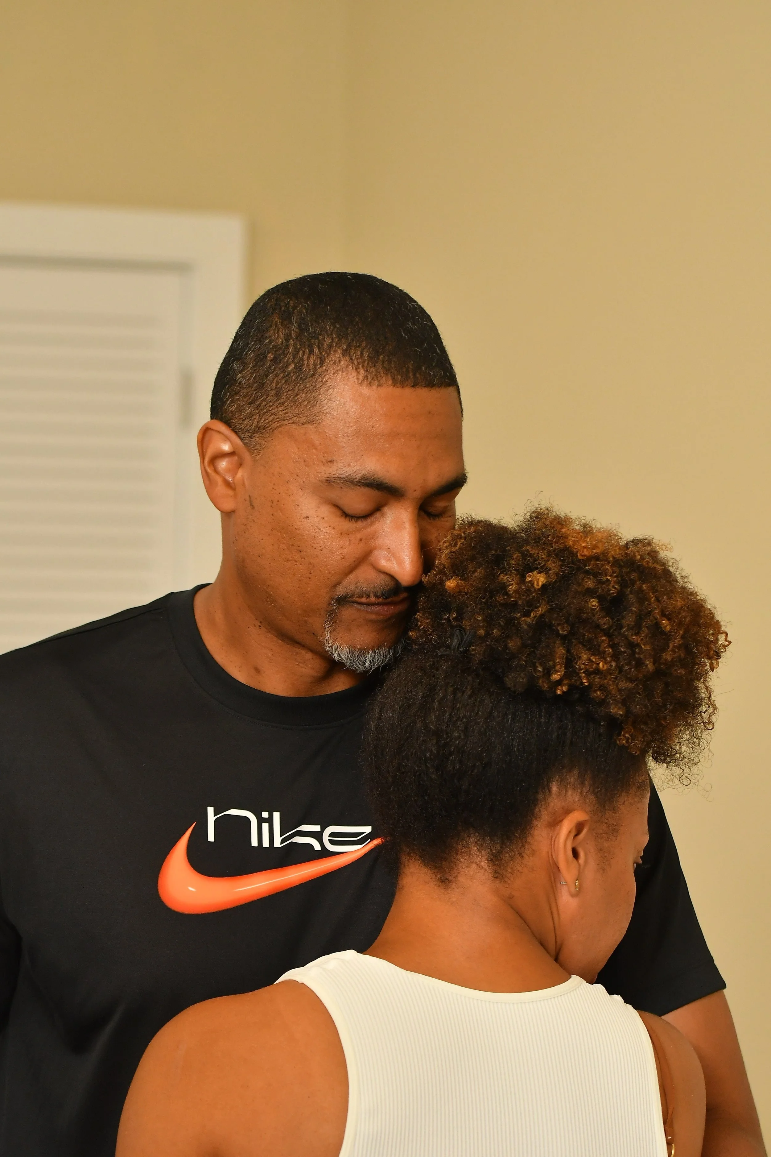 marriage intensive black couple embracing