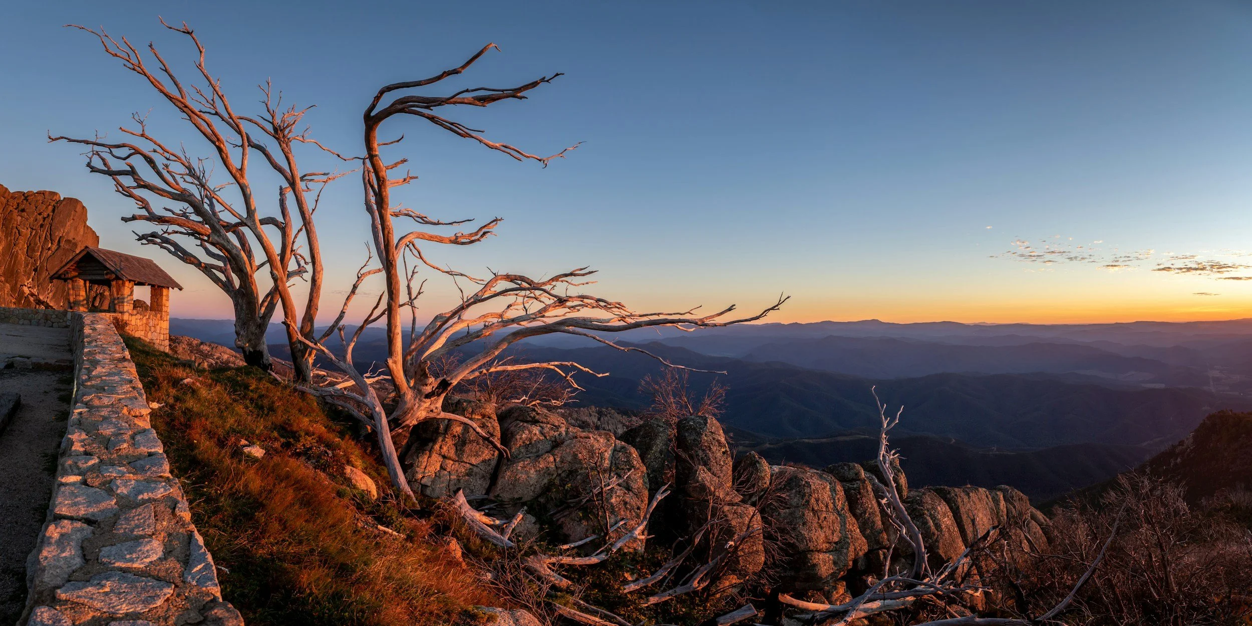 From on top of the world at Mount Buffalo your view of the sunset seems to go on forever.