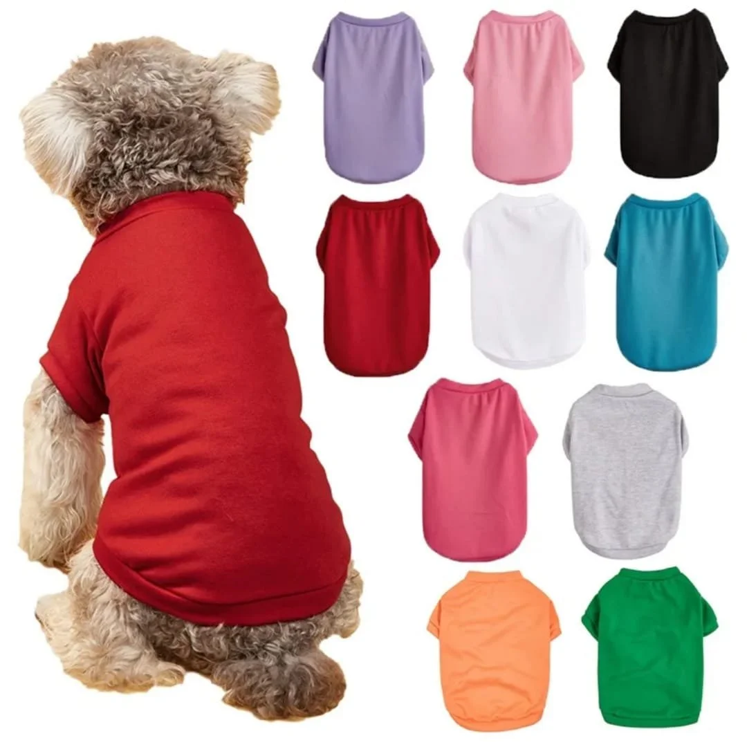 A dog wearing a red shirt sits facing away, with a display of ten different colored shirts in various colors including purple, pink, black, red, white, blue, gray, orange, and green in the background.