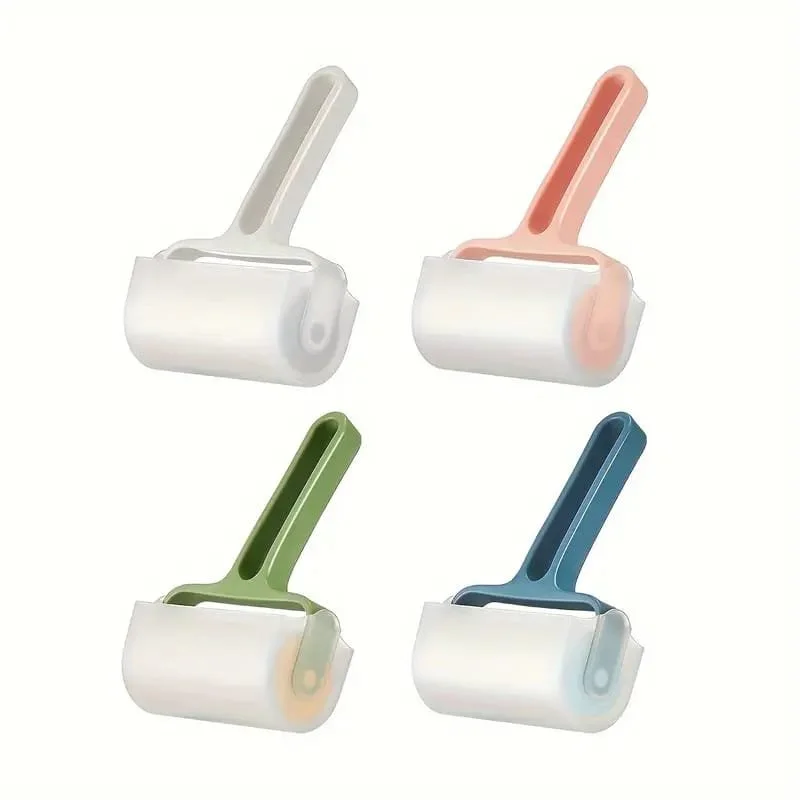 Four lint rollers with colorful handles in white, pink, green, and blue, arranged in a grid pattern.